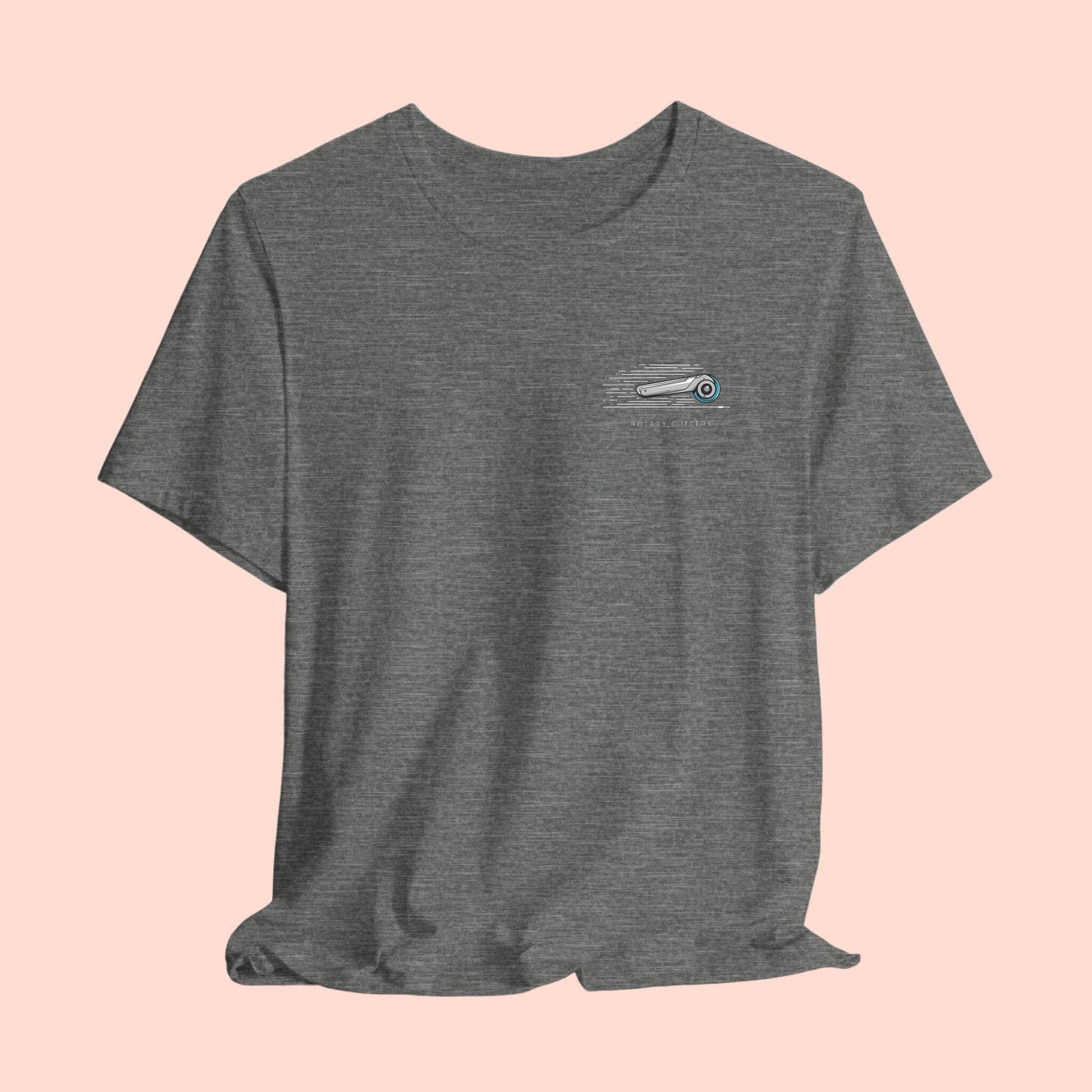 A T-shirt featuring minimalist graphic of a sleek rotary cutter in motion with speed lines. Text below reads "RUNS WITH ROTARY CUTTERS" in a modern font.