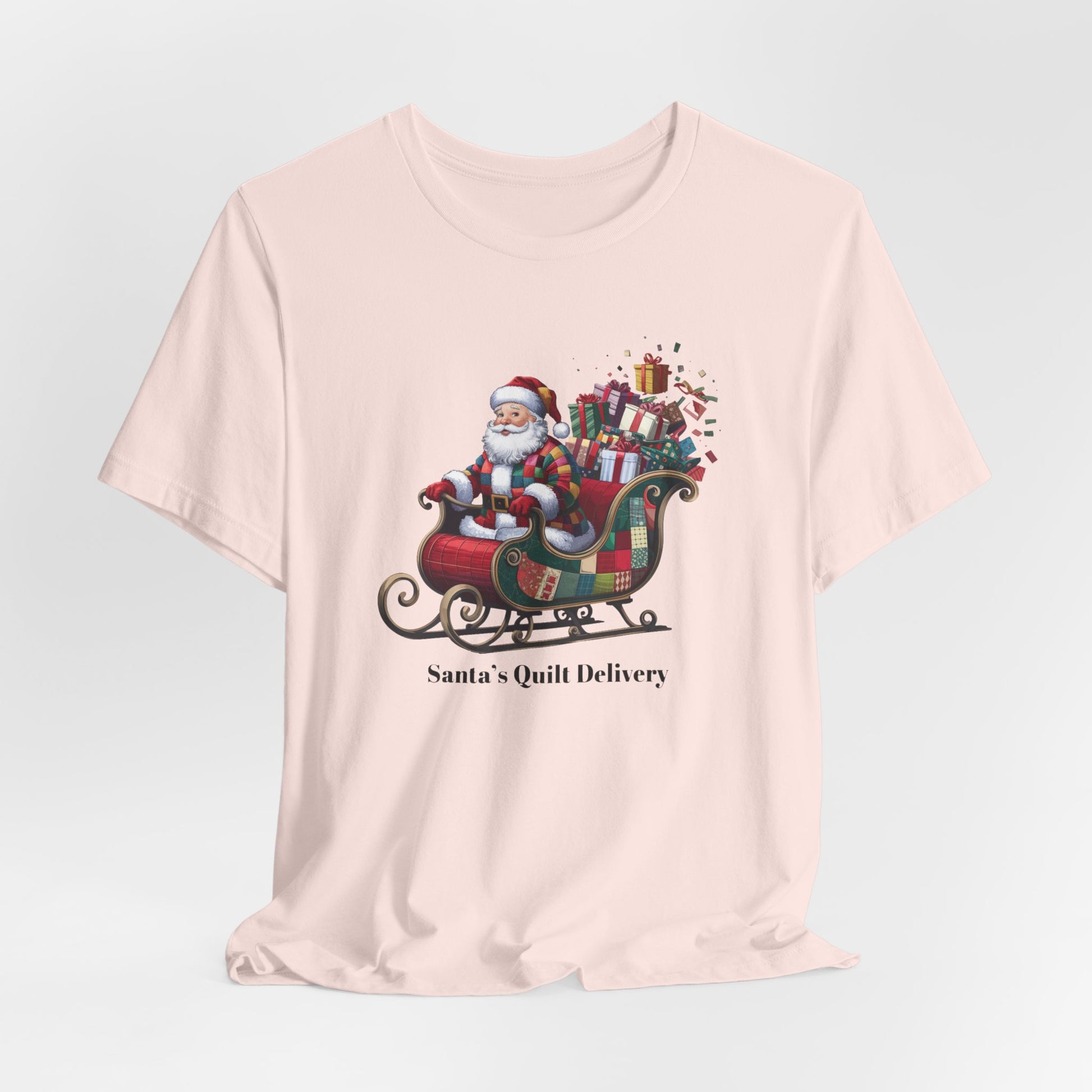 A christmas quilting t-shirt featuring Santa Claus wearing a patchwork quilt coat, sitting in a sleigh filled with gifts and quilts, with the phrase "Santa's Quilt Delivery" below, combining holiday cheer and quilting fun.