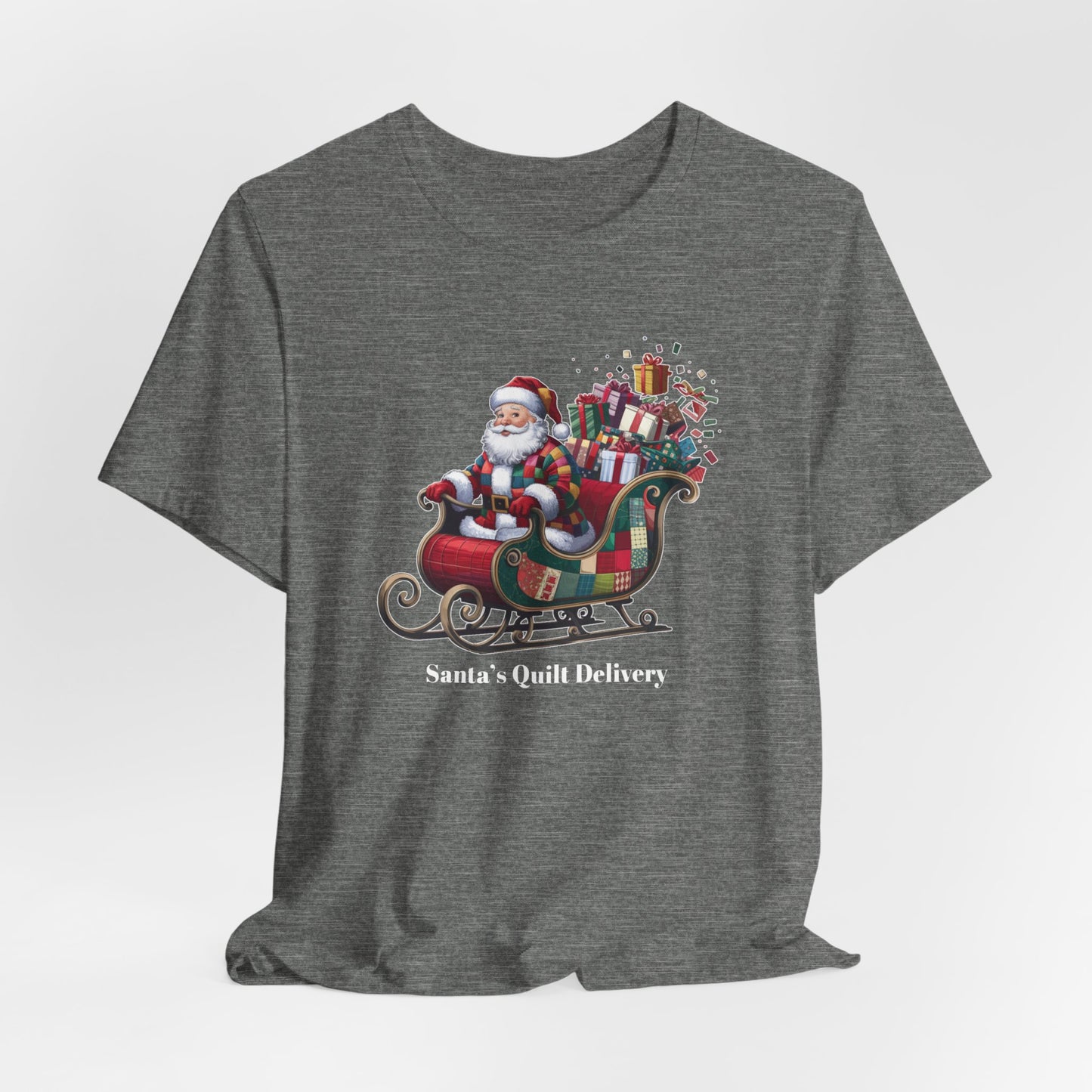 A Deep Heather christmas quilting t-shirt featuring Santa Claus wearing a patchwork quilt coat, sitting in a sleigh filled with gifts and quilts, with the phrase "Santa's Quilt Delivery" below, combining holiday cheer and quilting fun.