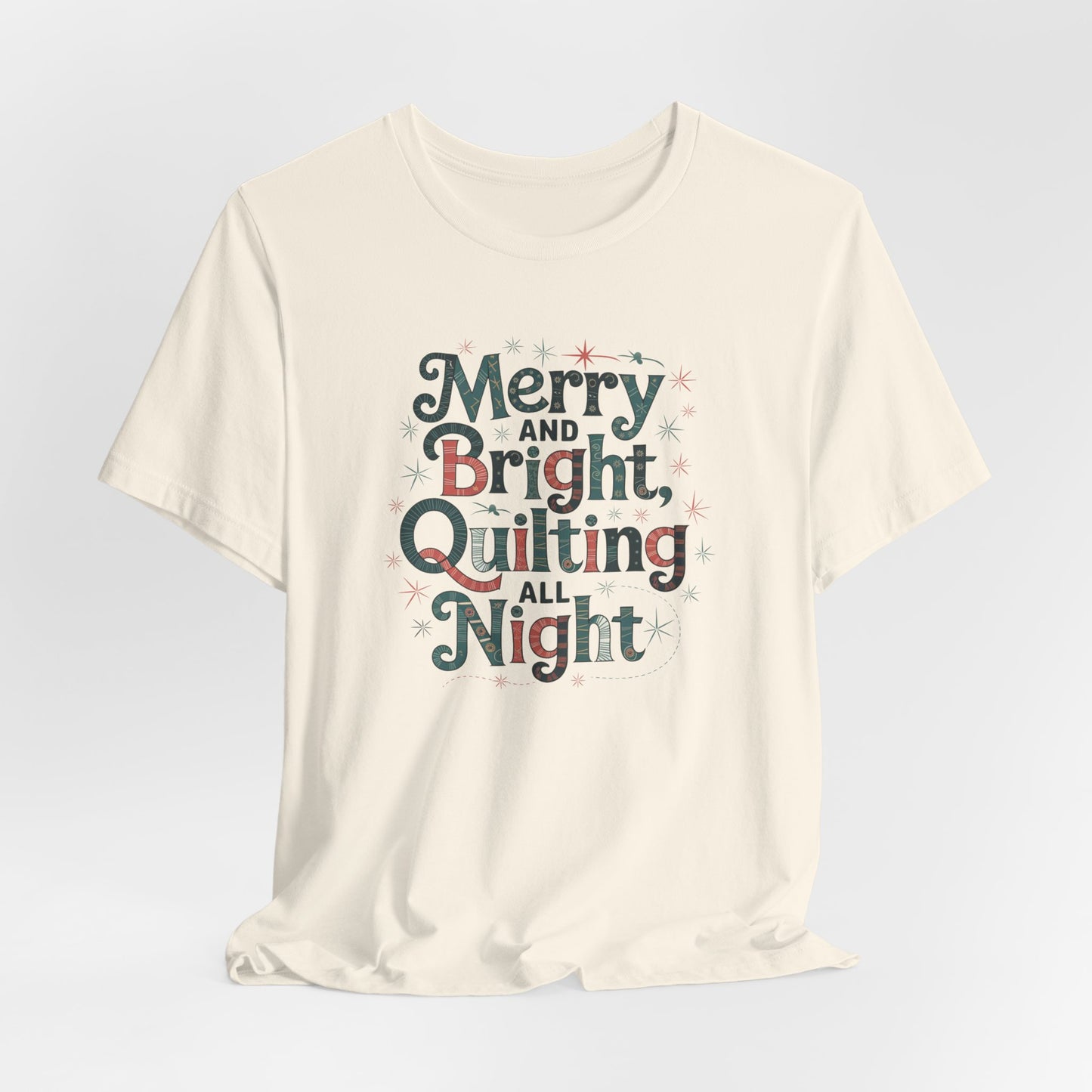 A Natural christmas quilting T-shirt featuring a whimsical design with the phrase "Merry and Bright, Quilting All Night," featuring festive quilting patterns and holiday-themed elements like stars and stitching lines. Perfect gift for quilters.