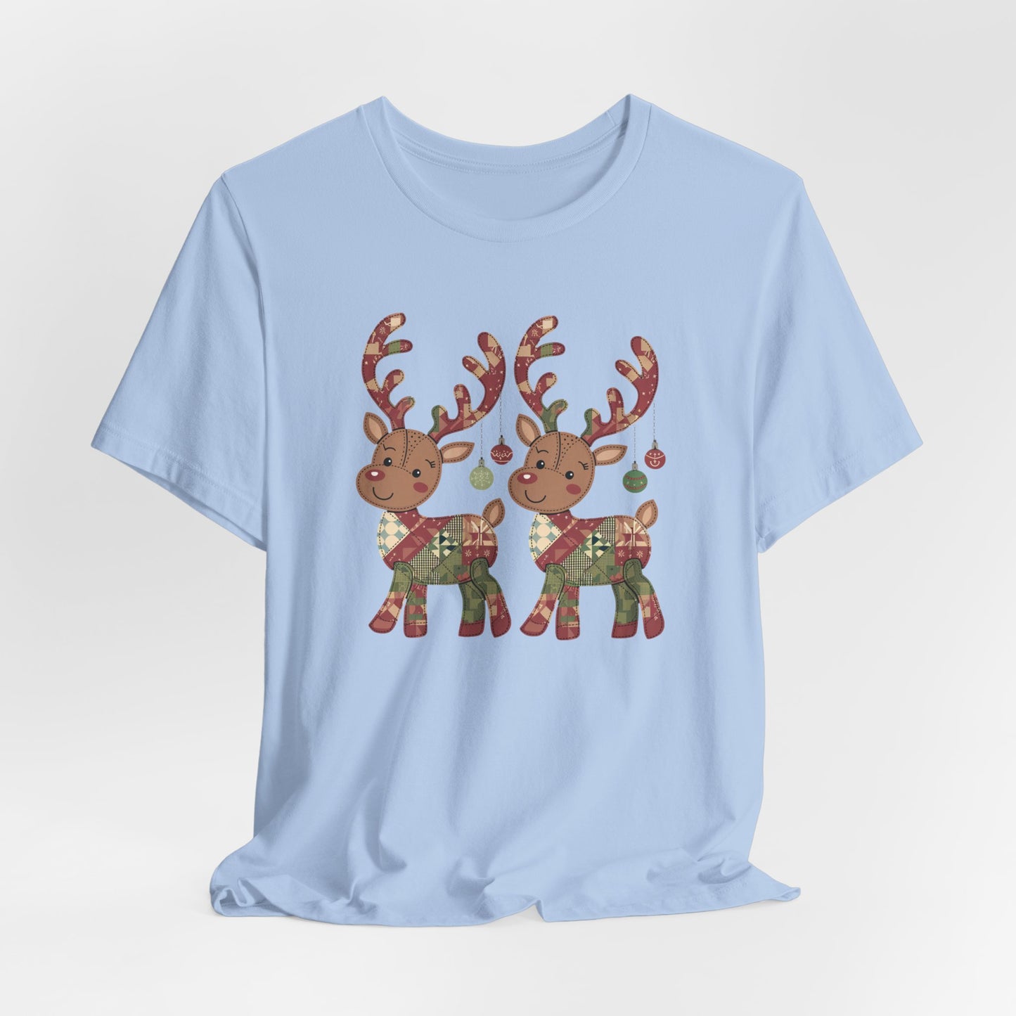 A Baby Blue christmas quilting t-shirt featuring two adorable reindeer featuring patchwork quilt designs on their bodies, with ornaments hanging from their antlers, blending Christmas cheer with quilting creativity.