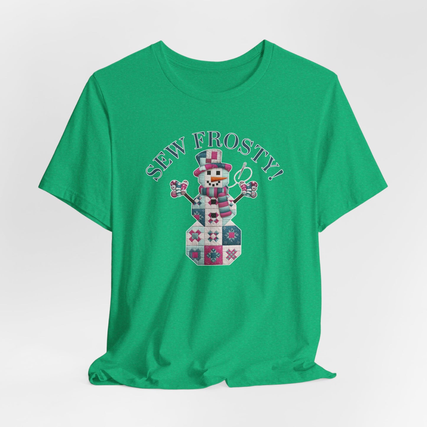 A Heather Kelly christmas quilting t-shirt featuring cute snowman made of patchwork quilt blocks with the phrase "Sew Frosty" above, holding a needle to highlight the quilting theme.