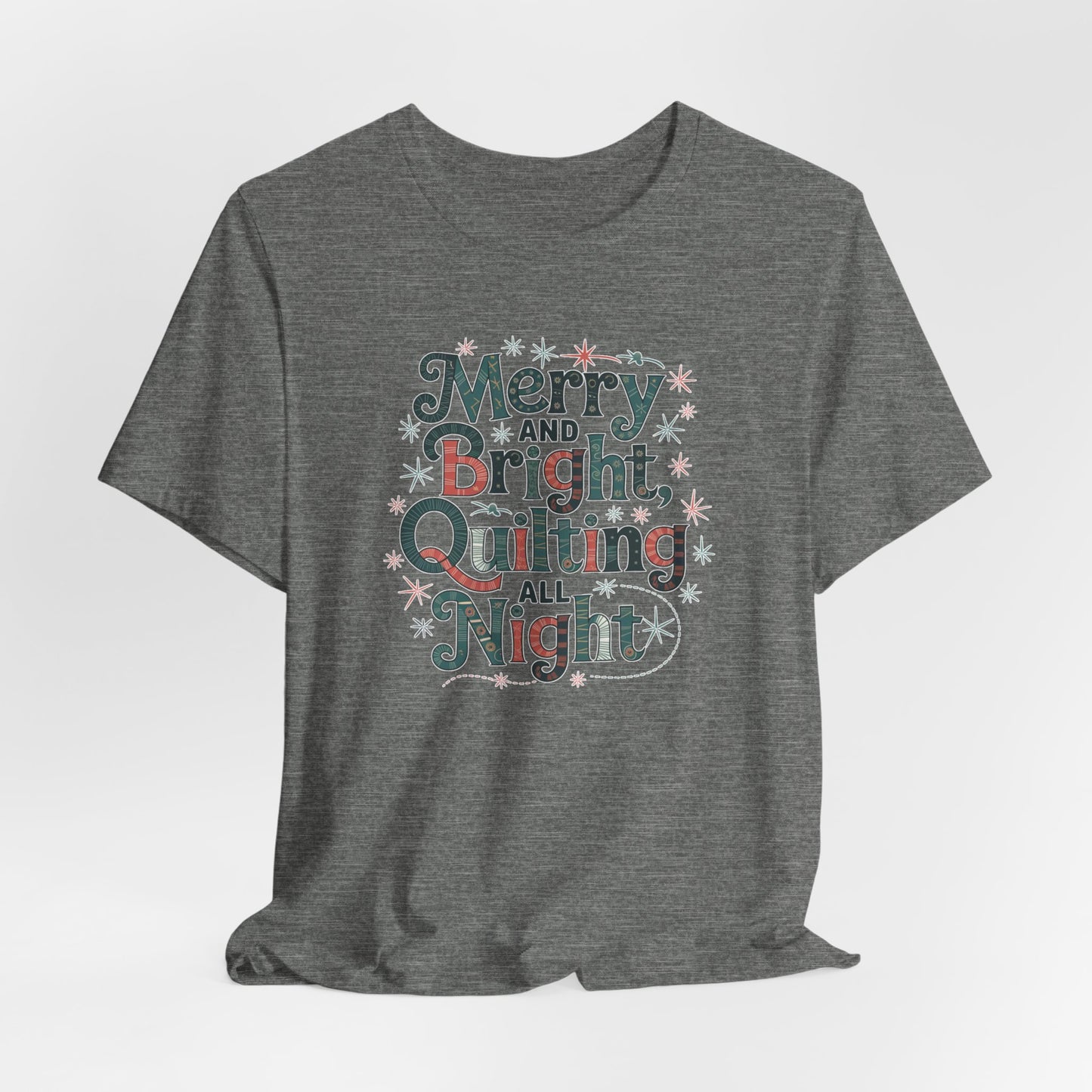A Deep Heather christmas quilting T-shirt featuring a whimsical design with the phrase "Merry and Bright, Quilting All Night," featuring festive quilting patterns and holiday-themed elements like stars and stitching lines. Perfect gift for quilters.