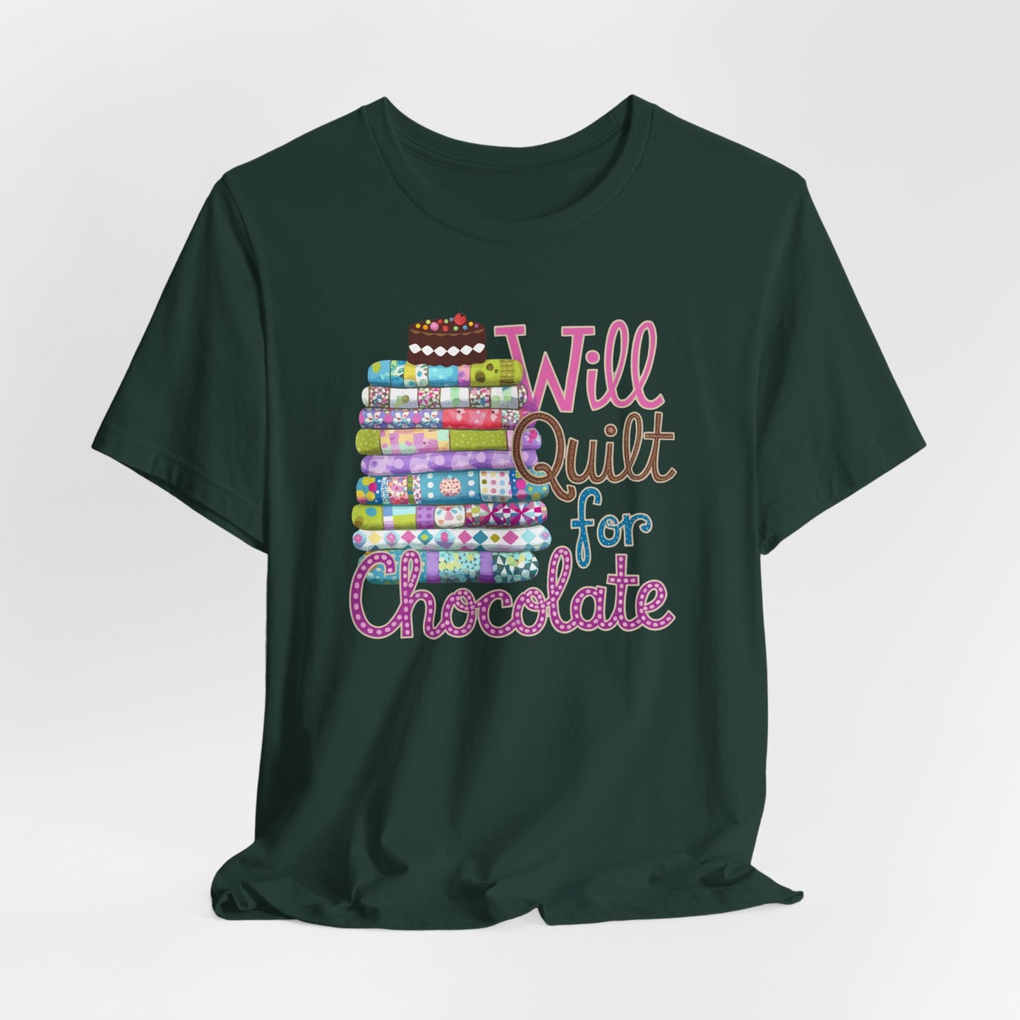 A Forest t-shirt featuring a whimsical design of a colorful stack of quilts topped with a chocolate cake and the phrase 'Will Quilt for Chocolate,' perfect for quilters who love sweets.