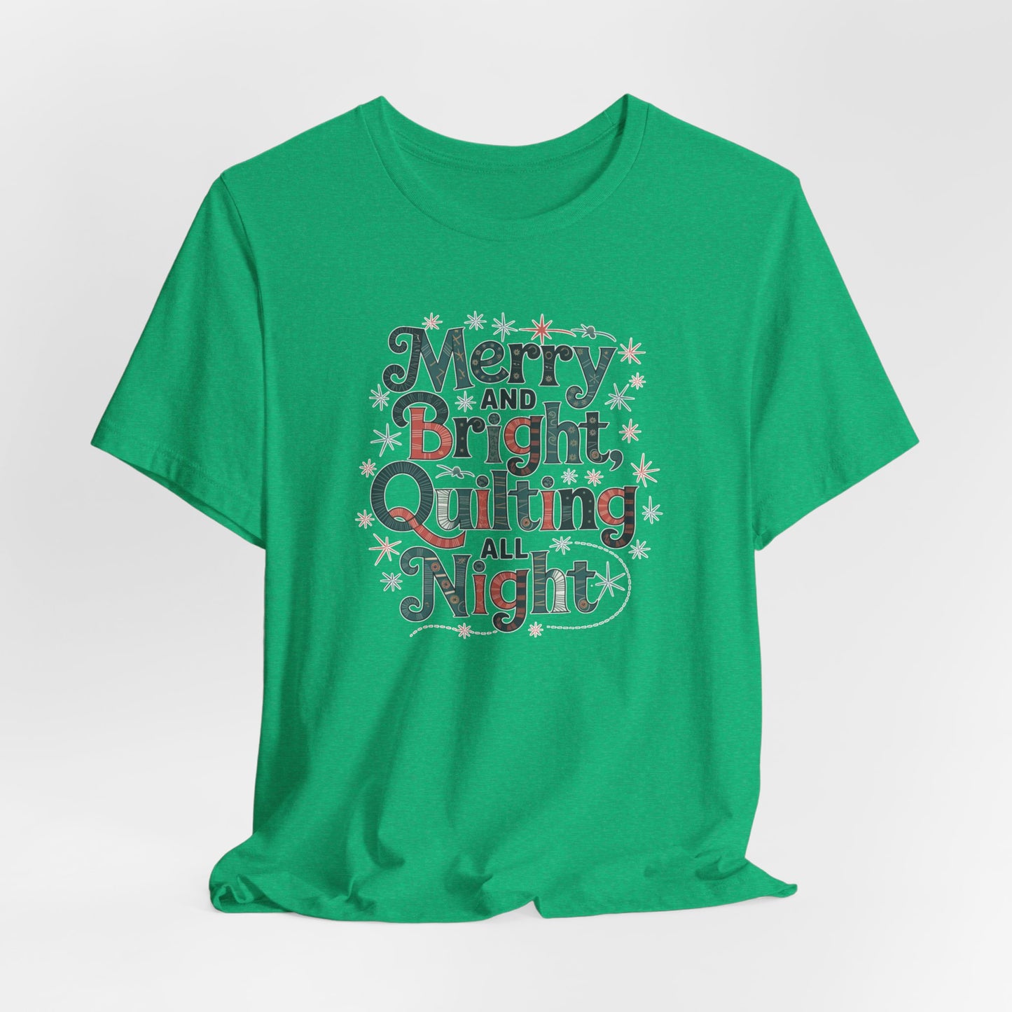 A Heather Kelly christmas quilting T-shirt featuring a whimsical design with the phrase "Merry and Bright, Quilting All Night," featuring festive quilting patterns and holiday-themed elements like stars and stitching lines. Perfect gift for quilters.
