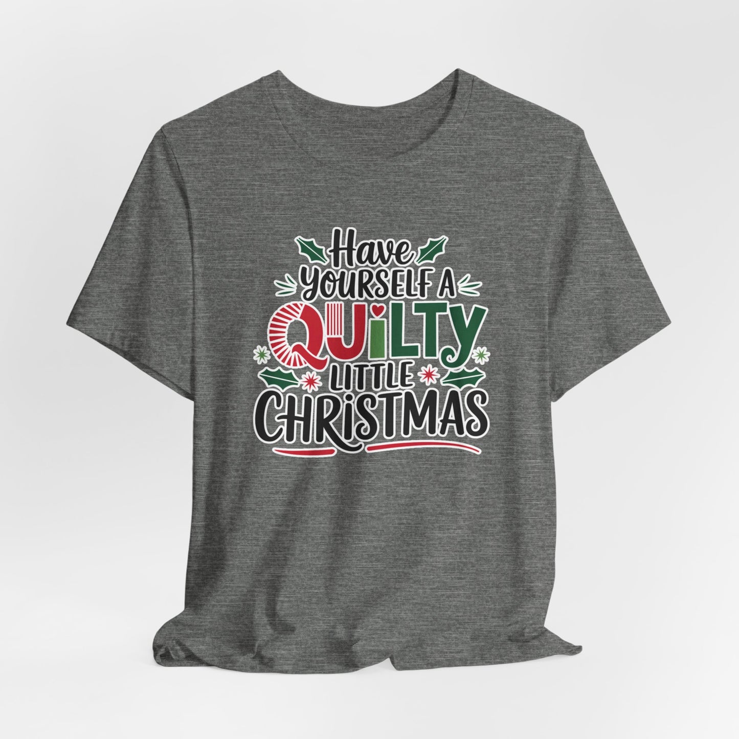 A Deep Heather fun holiday-themed t-shirt featuring the phrase "Have Yourself a Quilty Little Christmas" with quilting-inspired elements and holiday decorations such as holly and stars.