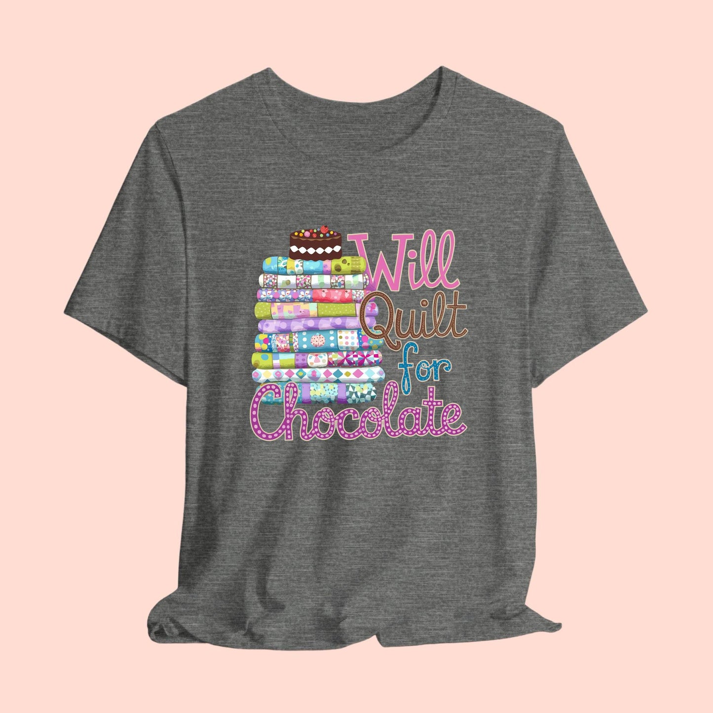 A t-shirt featuring a whimsical design of a colorful stack of quilts topped with a chocolate cake and the phrase 'Will Quilt for Chocolate,' perfect for quilters who love sweets.