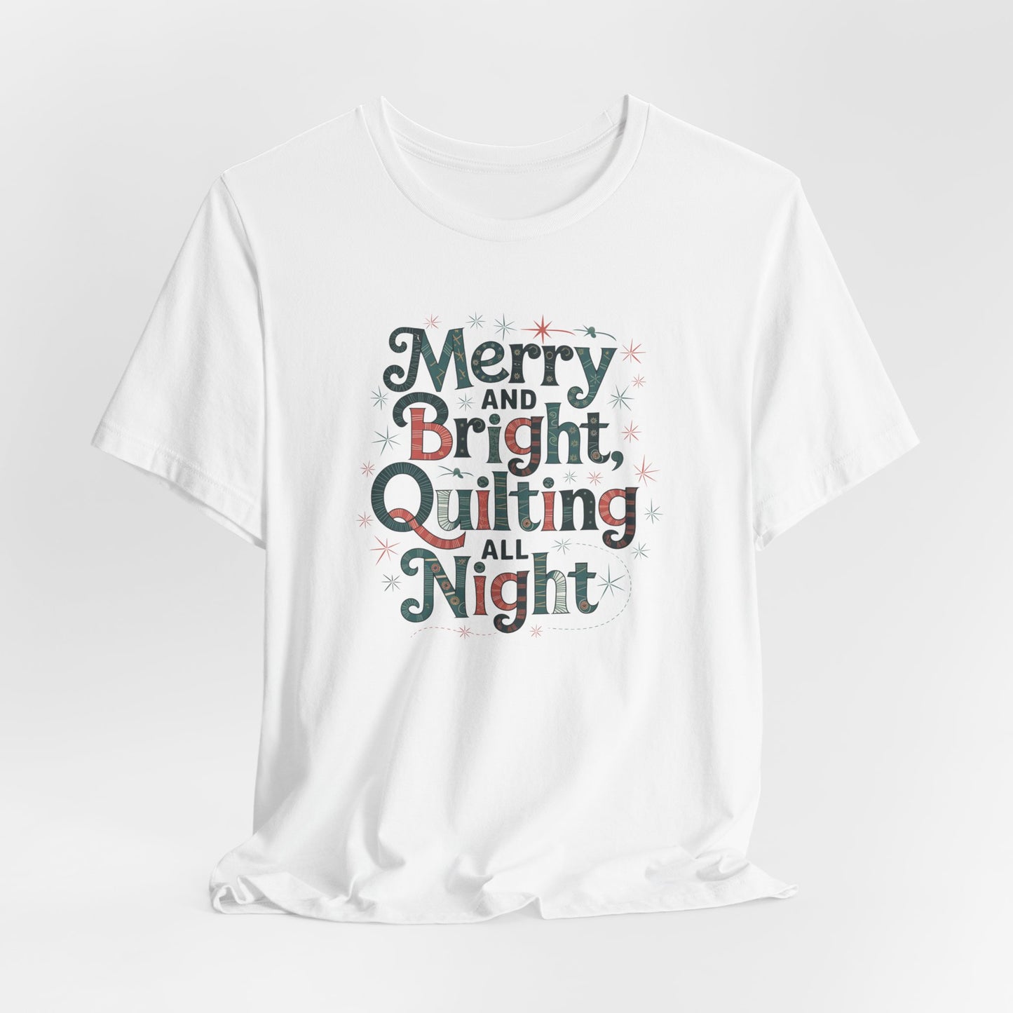 A White christmas quilting T-shirt featuring a whimsical design with the phrase "Merry and Bright, Quilting All Night," featuring festive quilting patterns and holiday-themed elements like stars and stitching lines. Perfect gift for quilters.