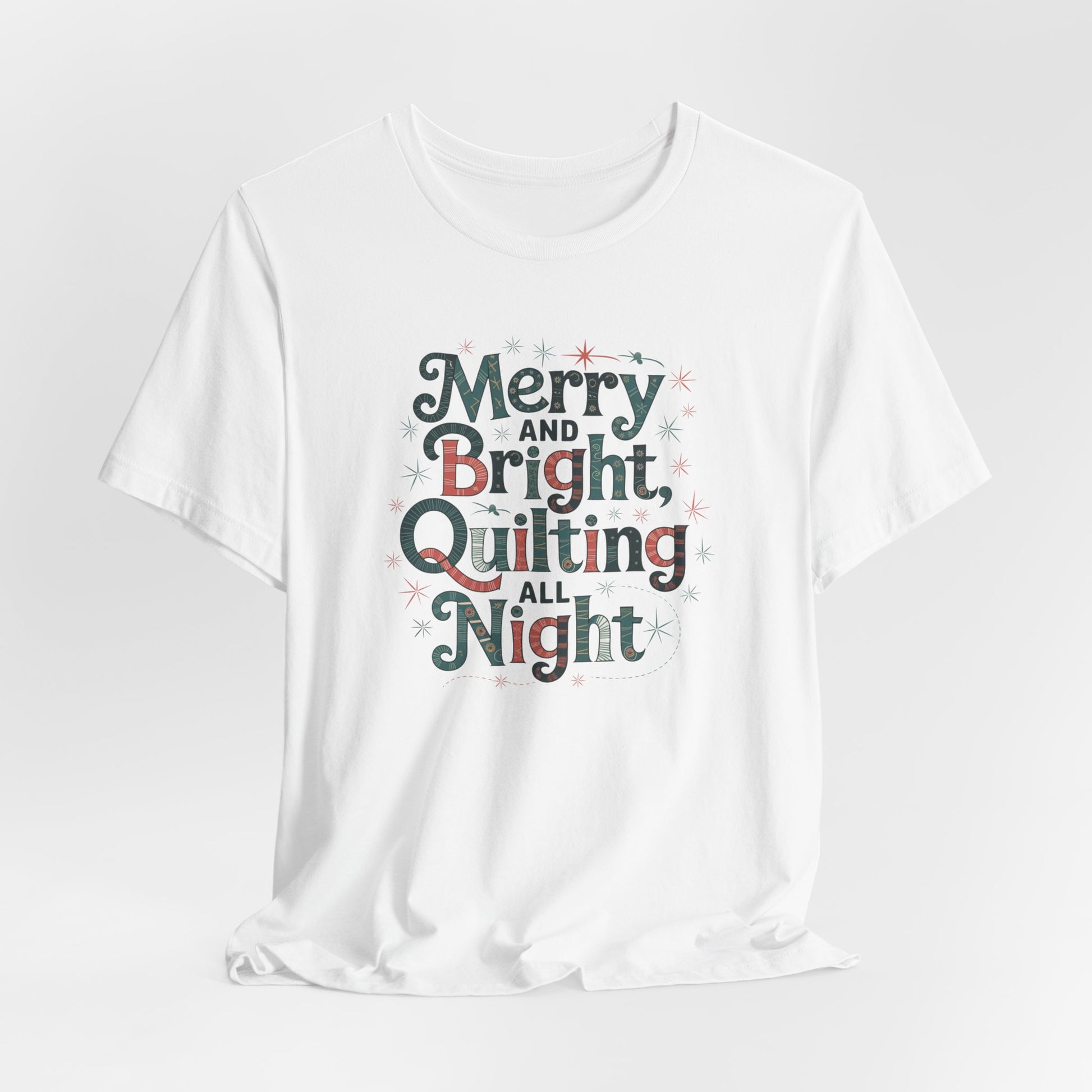 A White christmas quilting T-shirt featuring a whimsical design with the phrase "Merry and Bright, Quilting All Night," featuring festive quilting patterns and holiday-themed elements like stars and stitching lines.  Perfect gift for quilters.