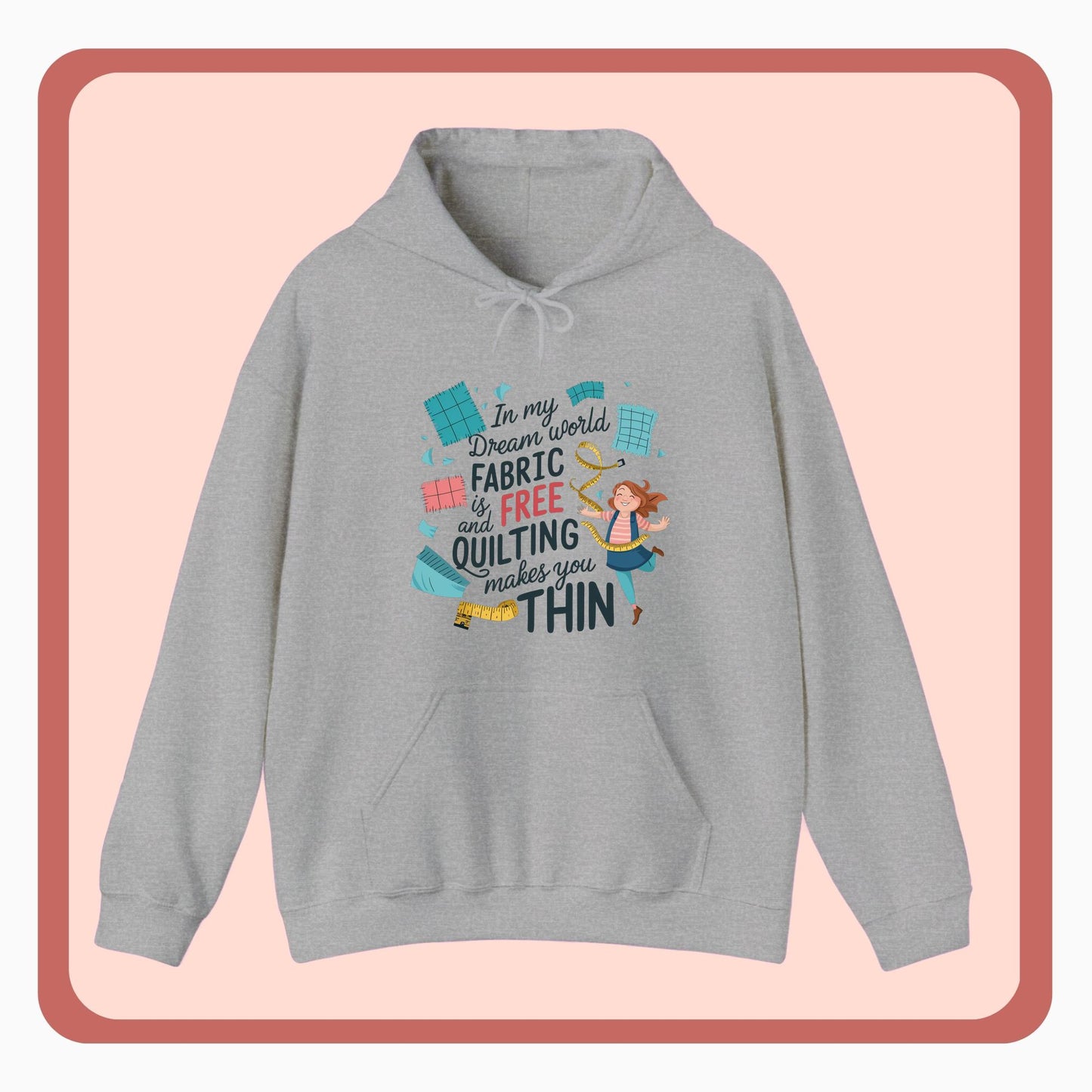 A funny Hoodie with the phrase Fabric is Free and Quilting Makes You Thin in font with a cheerful quilter jumping for joy