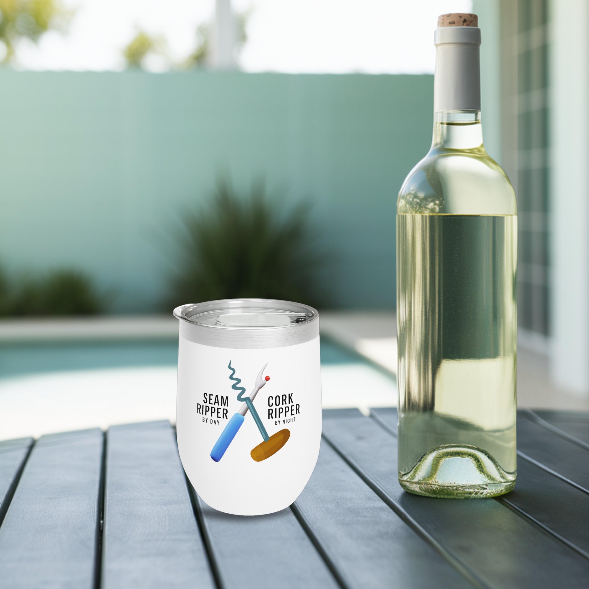 A funny quilting-inspired wine tumbler with the phrase Seam Ripper by Day, Cork Ripper by Night.  The perfect gift for quilters.