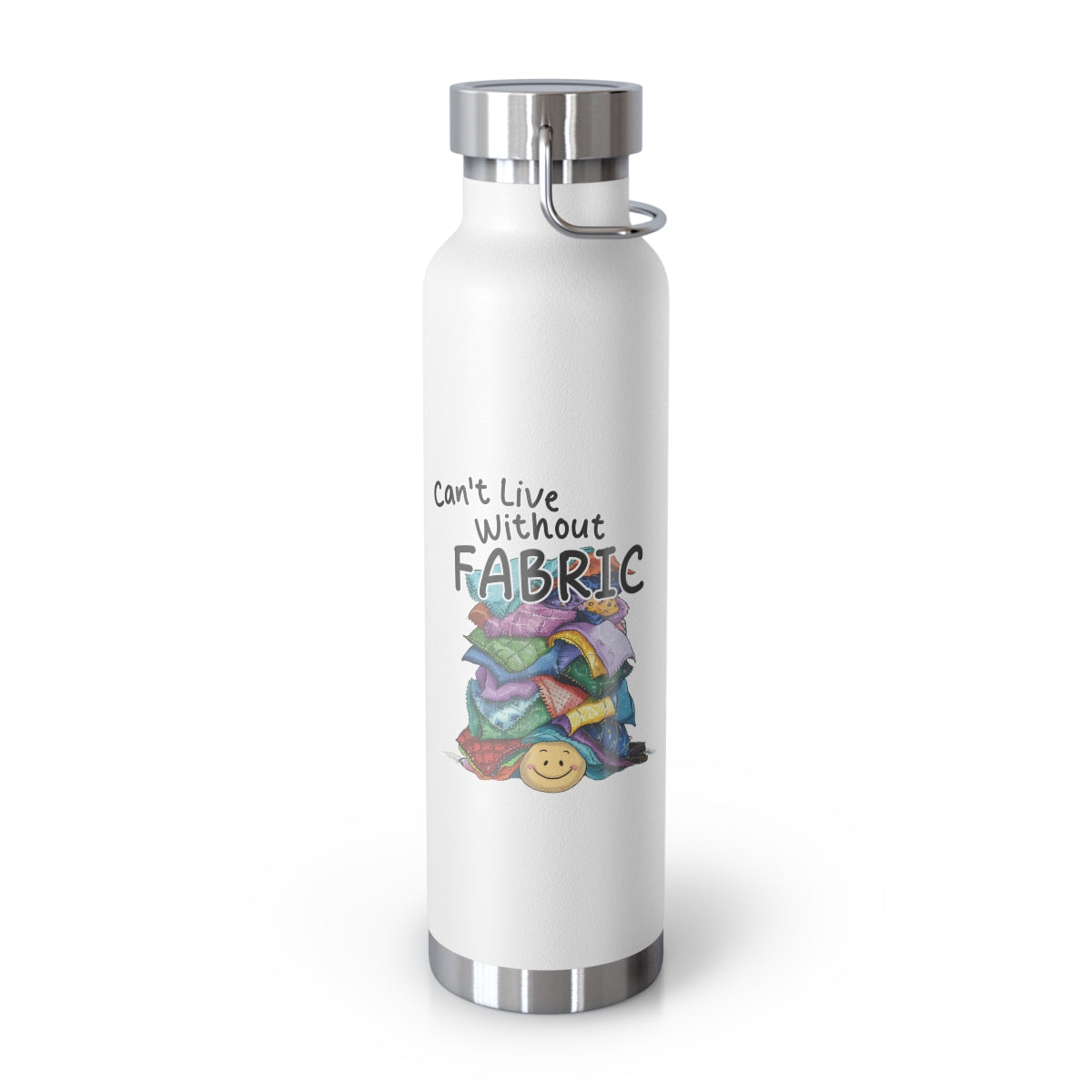 A White funny quilting-inspired Insulated Bottle with a cute illustration showing a happy face under a pile of multicolored fabric pieces. Hand-lettered text says "Can't Live Without Fabric". The fabrics display various patterns and textures.
