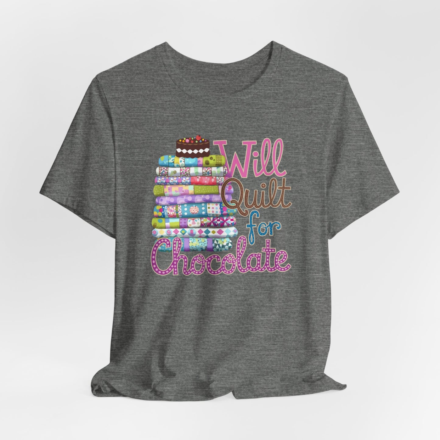 A Deep Heather t-shirt featuring a whimsical design of a colorful stack of quilts topped with a chocolate cake and the phrase 'Will Quilt for Chocolate,' perfect for quilters who love sweets.
