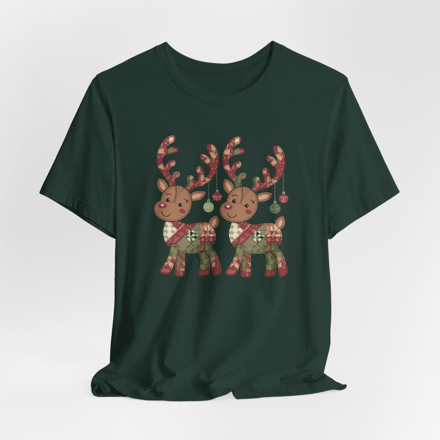 A Forest christmas quilting t-shirt featuring two adorable reindeer featuring patchwork quilt designs on their bodies, with ornaments hanging from their antlers, blending Christmas cheer with quilting creativity.