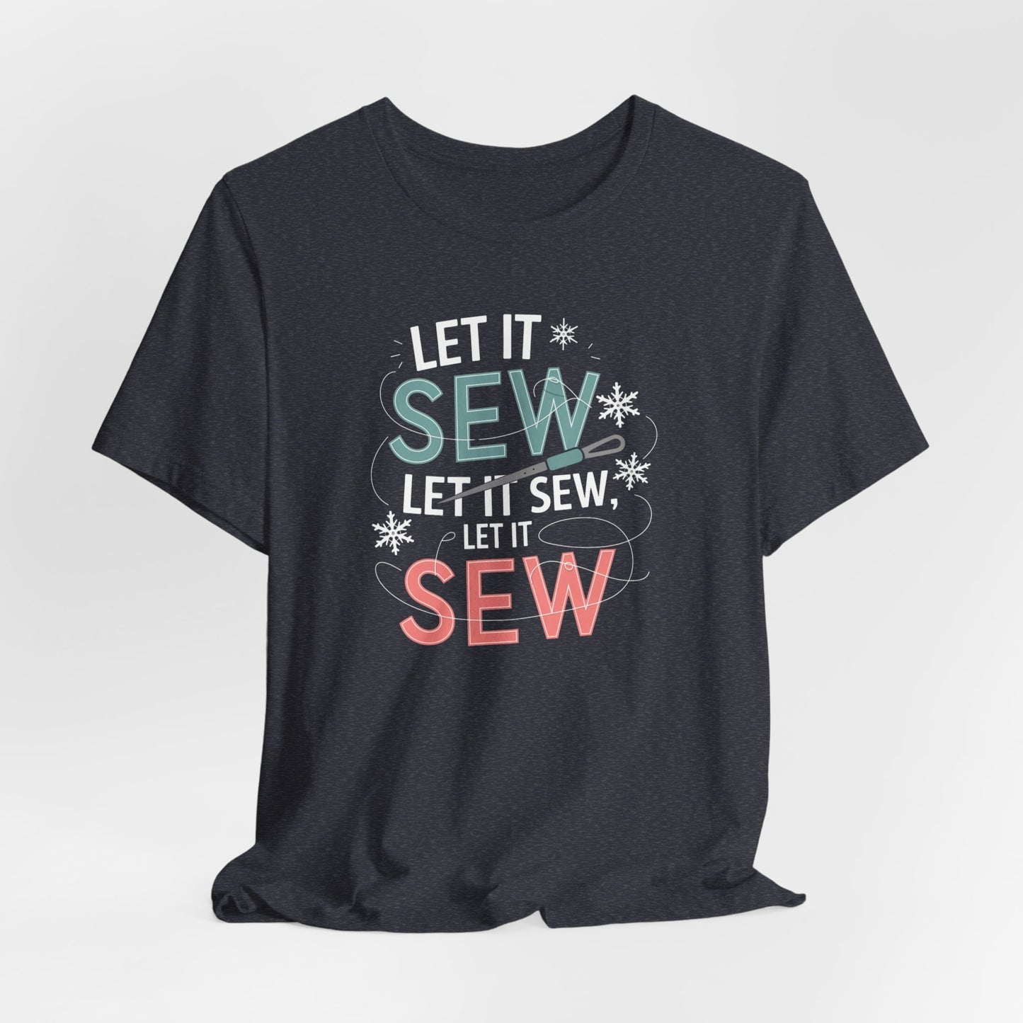 A Heather Navy christmas quilting t-shirt featuring the phrase "Let it Sew, Let it Sew, Let it Sew" featuring a needle and thread weaving through the letters, accented by snowflakes to bring out the holiday theme.