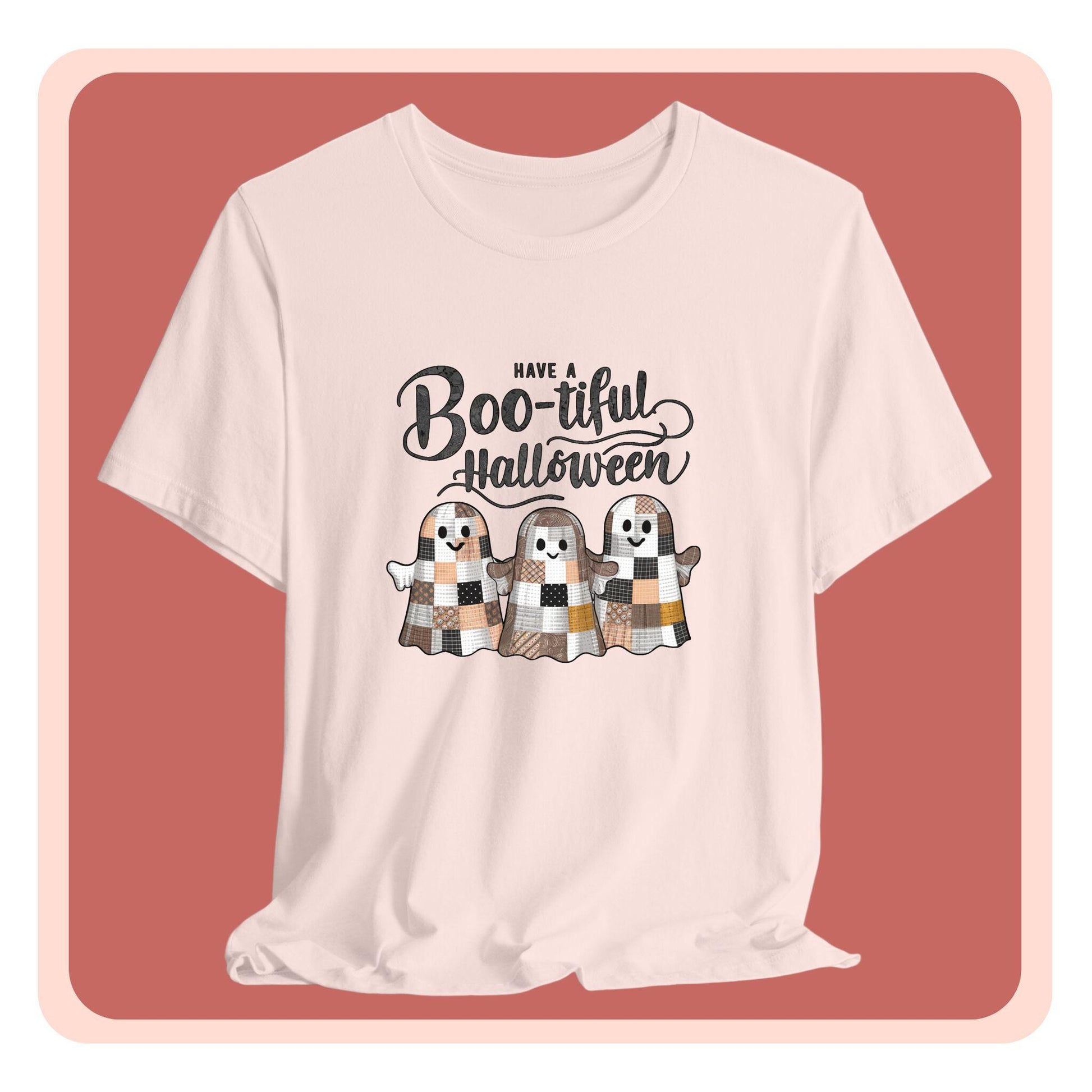 A Halloween Quilting T-Shirt featuring three smiling patchwork ghosts made of various quilt patterns in autumn colors. Text reads "Have a Boo-tiful Halloween" in stylized lettering. Perfect for quilters who love Halloween.