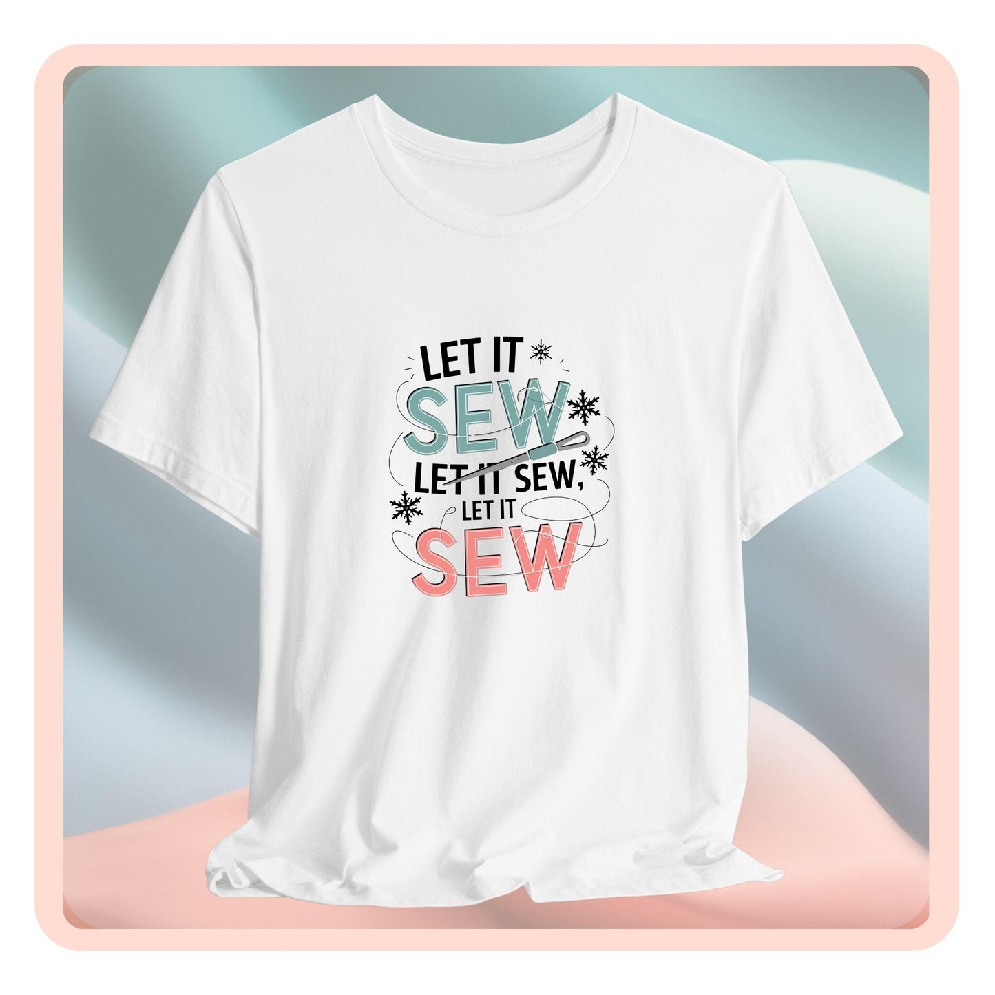 A christmas quilting t-shirt featuring the phrase "Let it Sew, Let it Sew, Let it Sew" featuring a needle and thread weaving through the letters, accented by snowflakes to bring out the holiday theme.