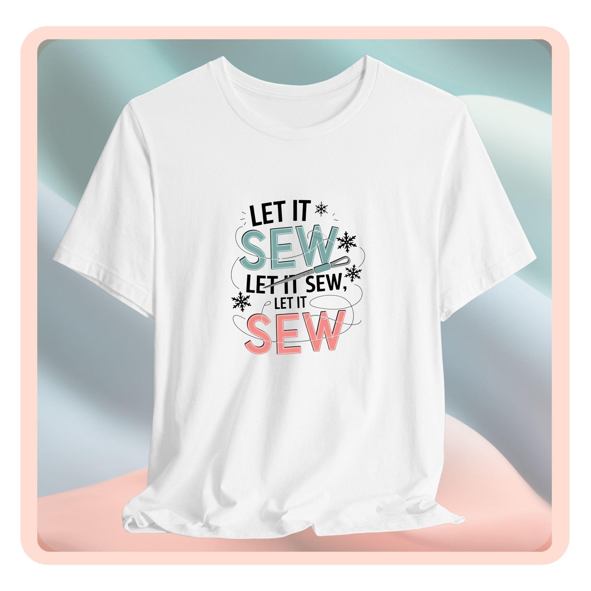 A christmas quilting t-shirt featuring the phrase "Let it Sew, Let it Sew, Let it Sew" featuring a needle and thread weaving through the letters, accented by snowflakes to bring out the holiday theme.