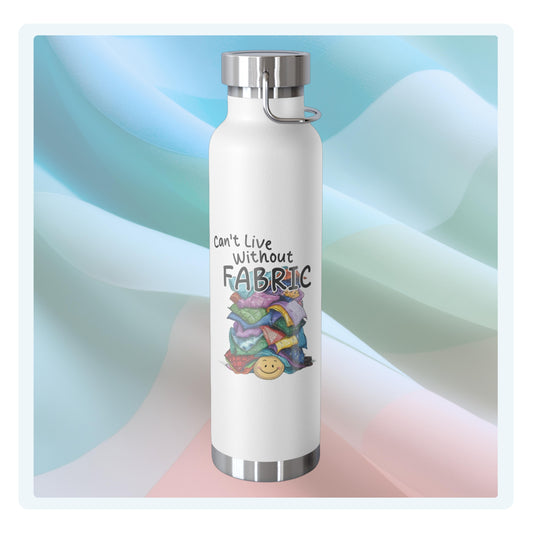 A funny quilting-inspired Insulated Bottle with a cute illustration showing a happy face under a pile of multicolored fabric pieces. Hand-lettered text says "Can't Live Without Fabric". The fabrics display various patterns and textures.