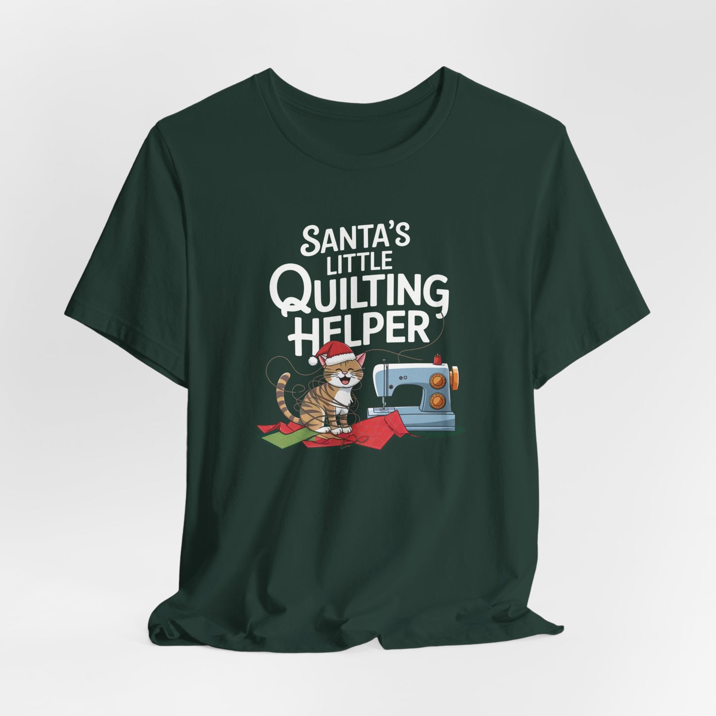 A Forest christmas quilting t-shirt featuring a playful cat wearing a Santa hat is tangled in thread next to a sewing machine, with the phrase "Santa's Little Quilting Helper" above, combining quilting and holiday humor.