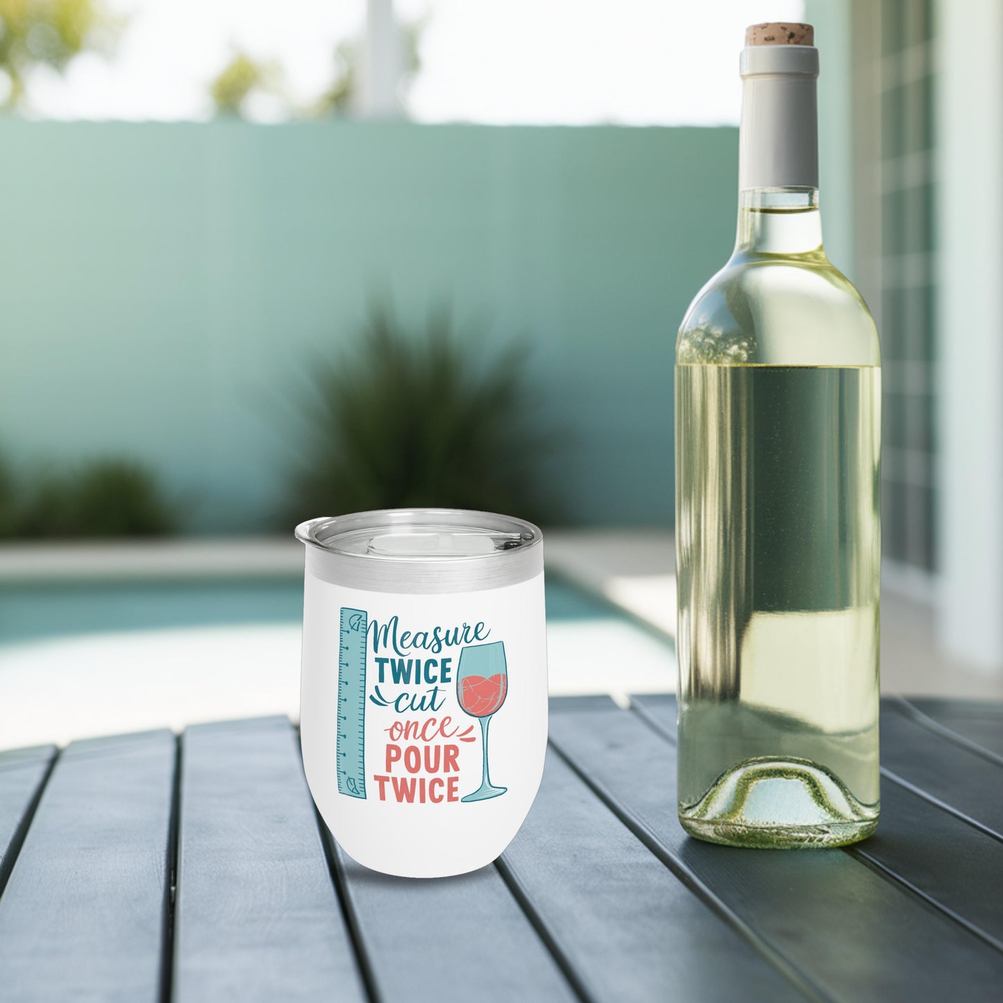 A funny quilting-inspired wine tumbler with the saying "Measure Twice, Cut Once, Pour Twice" on a wine tumbler with a measuring tape and wine glass.  The perfect gift for quilters.