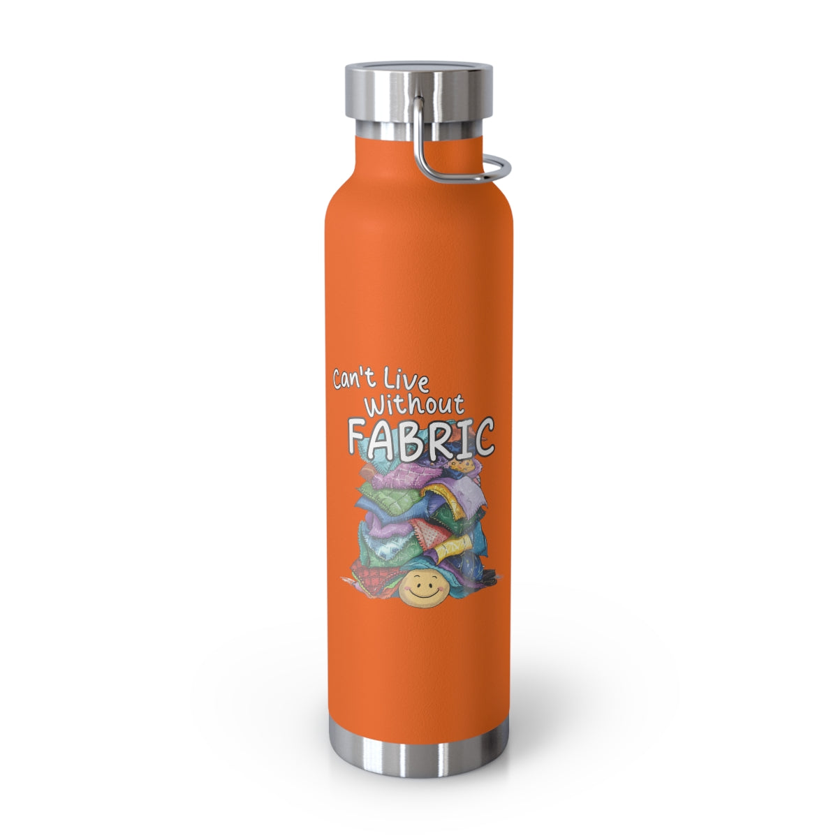 An Orange funny quilting-inspired Insulated Bottle with a cute illustration showing a happy face under a pile of multicolored fabric pieces. Hand-lettered text says "Can't Live Without Fabric". The fabrics display various patterns and textures.