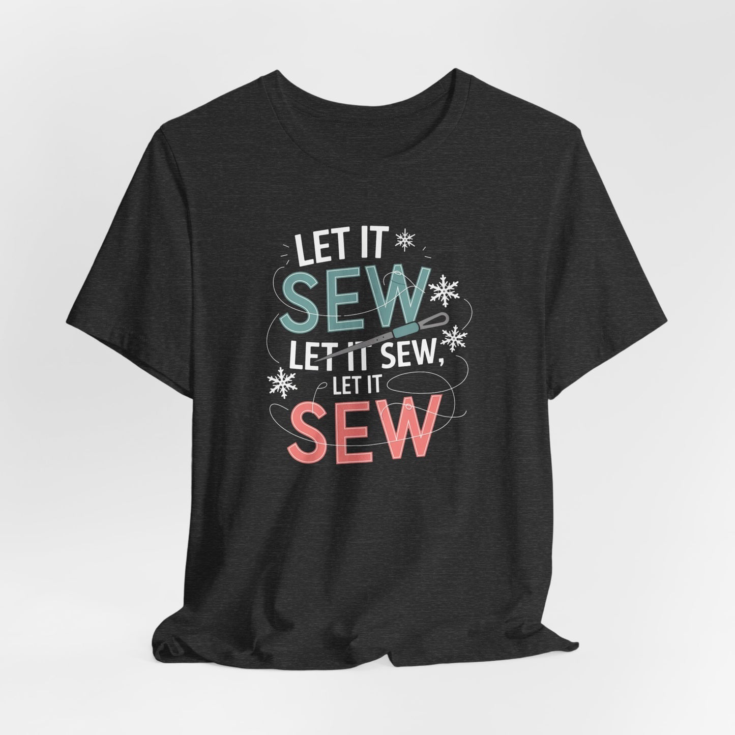A Dark Grey Heather christmas quilting t-shirt featuring the phrase "Let it Sew, Let it Sew, Let it Sew" featuring a needle and thread weaving through the letters, accented by snowflakes to bring out the holiday theme.