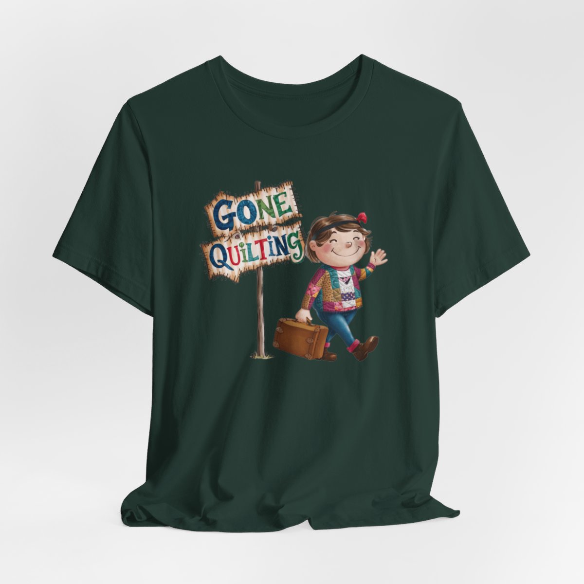 A Forestfun quilting T-Shirt with a cartoon illustration of a smiling girl wearing a patchwork jacket, carrying a suitcase next to a wooden sign that reads "Gone Quilting" in colorful letters.