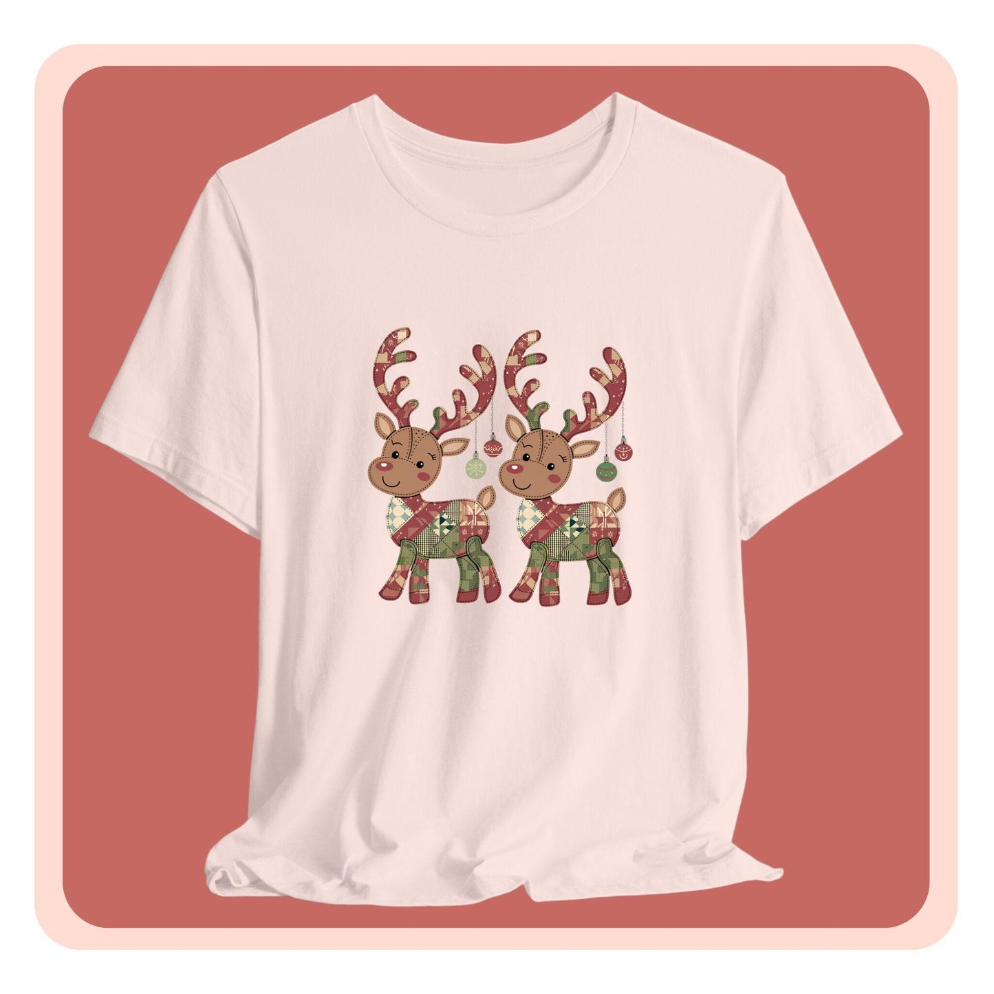 A christmas quilting t-shirt featuring two adorable reindeer featuring patchwork quilt designs on their bodies, with ornaments hanging from their antlers, blending Christmas cheer with quilting creativity.
