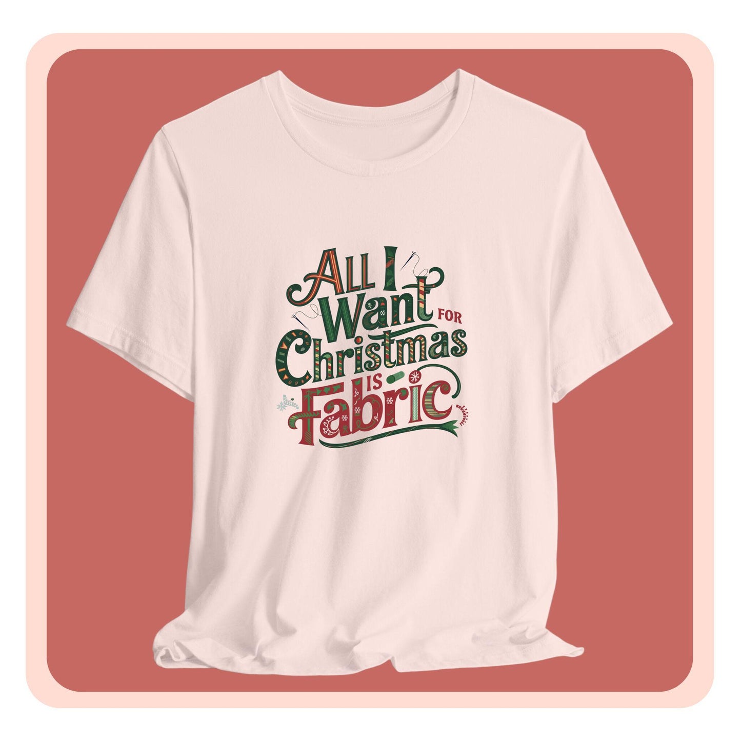 A festive quilting christmas T-shirt featuring the phrase "All I Want for Christmas is Fabric," with fun sewing and quilting accents like needles and threads swirling around the text.