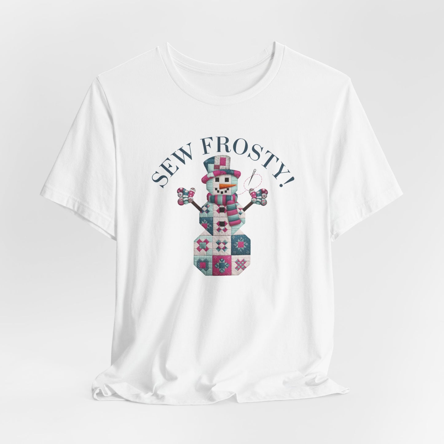 A White christmas quilting t-shirt featuring cute snowman made of patchwork quilt blocks with the phrase "Sew Frosty" above, holding a needle to highlight the quilting theme.