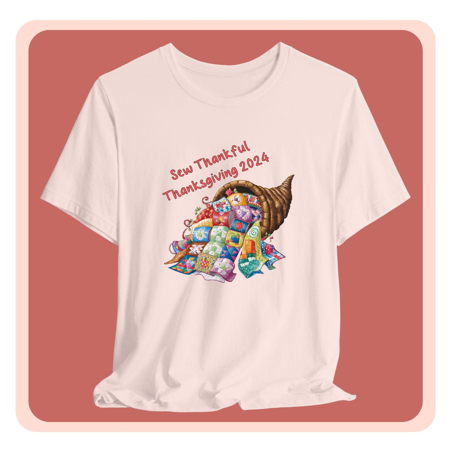 A thanksgiving quilting t-shirt featuring a colorful quilted cornucopia overflowing with various quilt patterns and designs. Text reads "Sew Thankful Thanksgiving 2024" in red. Vibrant illustration combines quilting motifs with Thanksgiving imagery.