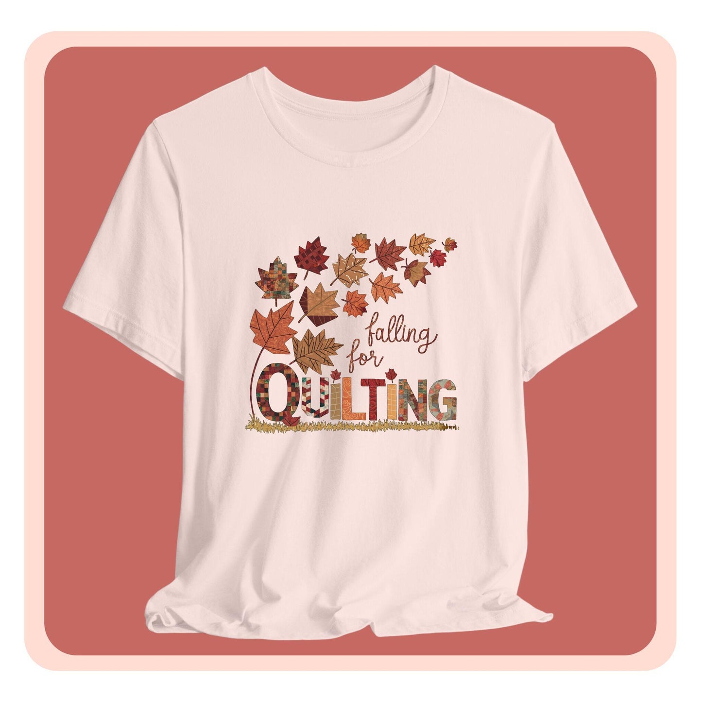 A thanksgiving quilting t-shirt featuring autumn leaves with various quilting patterns inside. Text reads "falling for QUILTING" with letters in patchwork style. Warm fall colors and quilting motifs combine in a seasonal design.