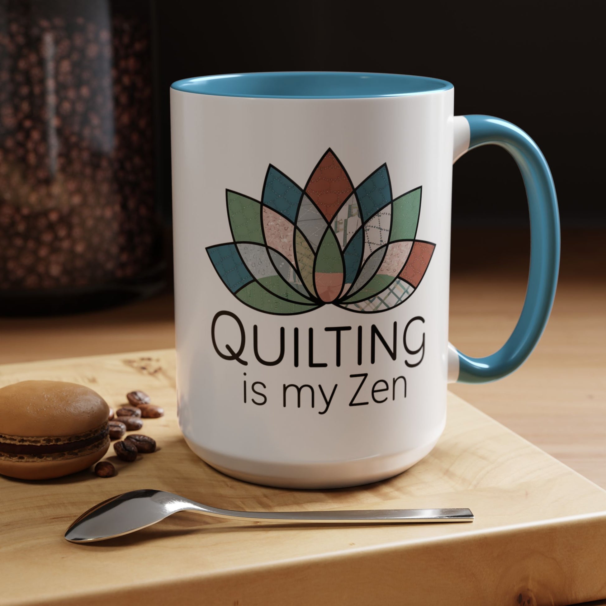 A funny Ceramic Mug with the phrase Quilting is my Zen on a quilting-themed t-shirt with a lotus flower design made of various quilt patterns and textures.