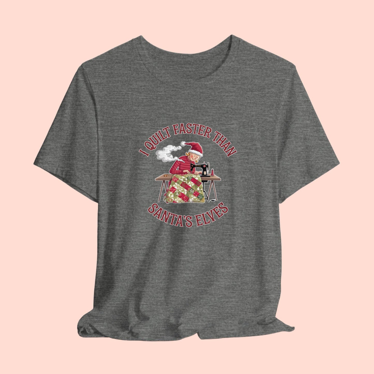 A christmas quilting t-shirt featuring a quilter working at a sewing machine, quilting a festive holiday quilt, with the phrase "I Quilt Faster Than Santa's Elves" above the image, highlighting the speed and skill of the quilter.