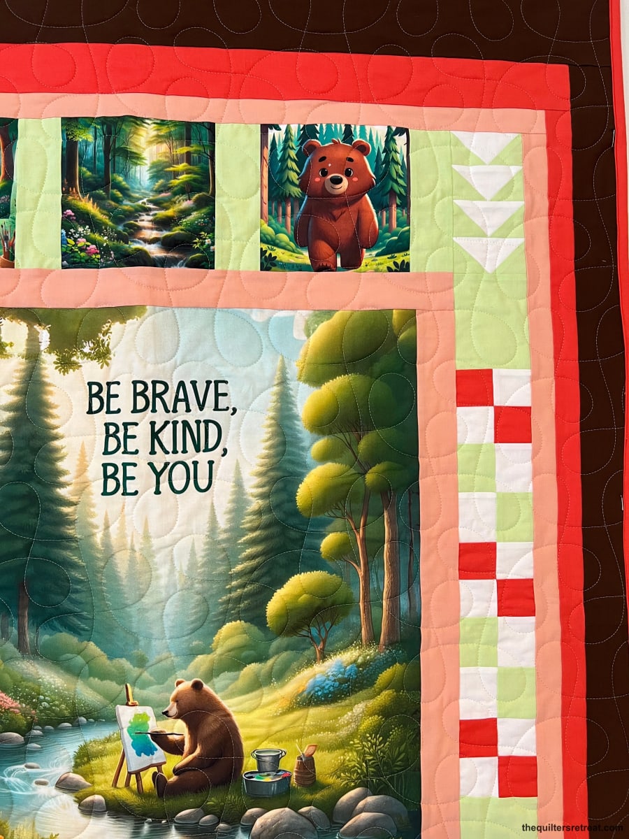 Close-up of the Be Kind Bear panel — a bear painting at an easel under 'Be Brave, Be Kind, Be You'