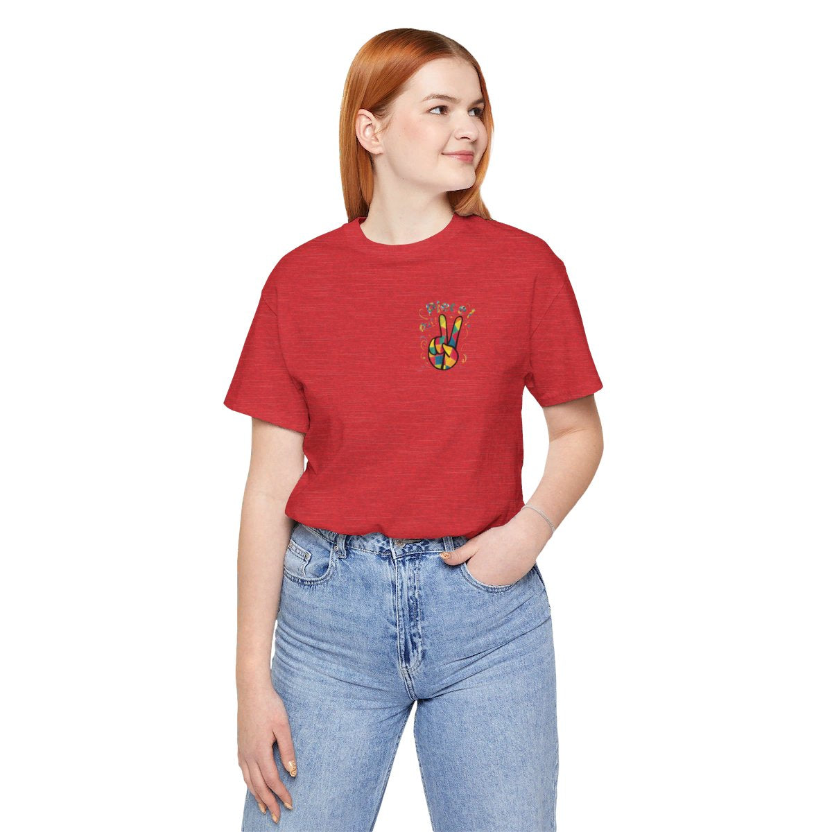 A Heather Red funny quilting t-shirt design featuring a patchwork peace sign hand gesture. The phrase "piece out!" is displayed in quilted-style lettering above the hand. Vibrant colors and quilt-like stitching patterns fill the peace sign, surrounded by playful swirls and star shapes, embodying the joyful spirit of quilting.