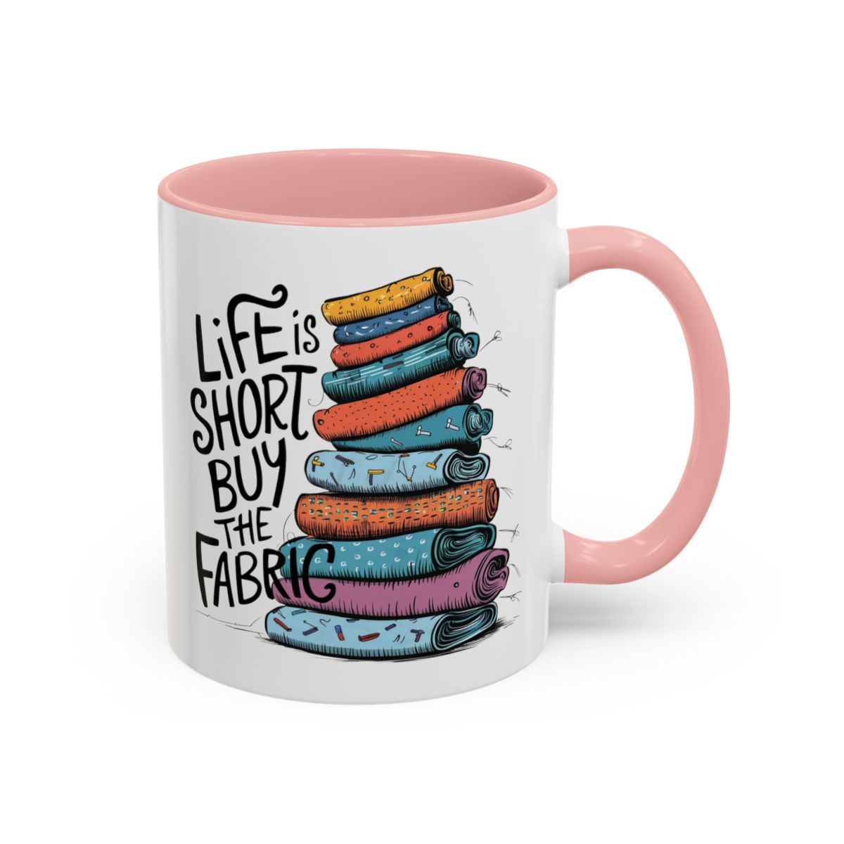 A Pink funny Ceramic Mug with the phrase Life is Short, Buy the Fabric with the label 'Life is Short, Buy the Fabric' next to a graphic of A Pink funny pile of fabric
