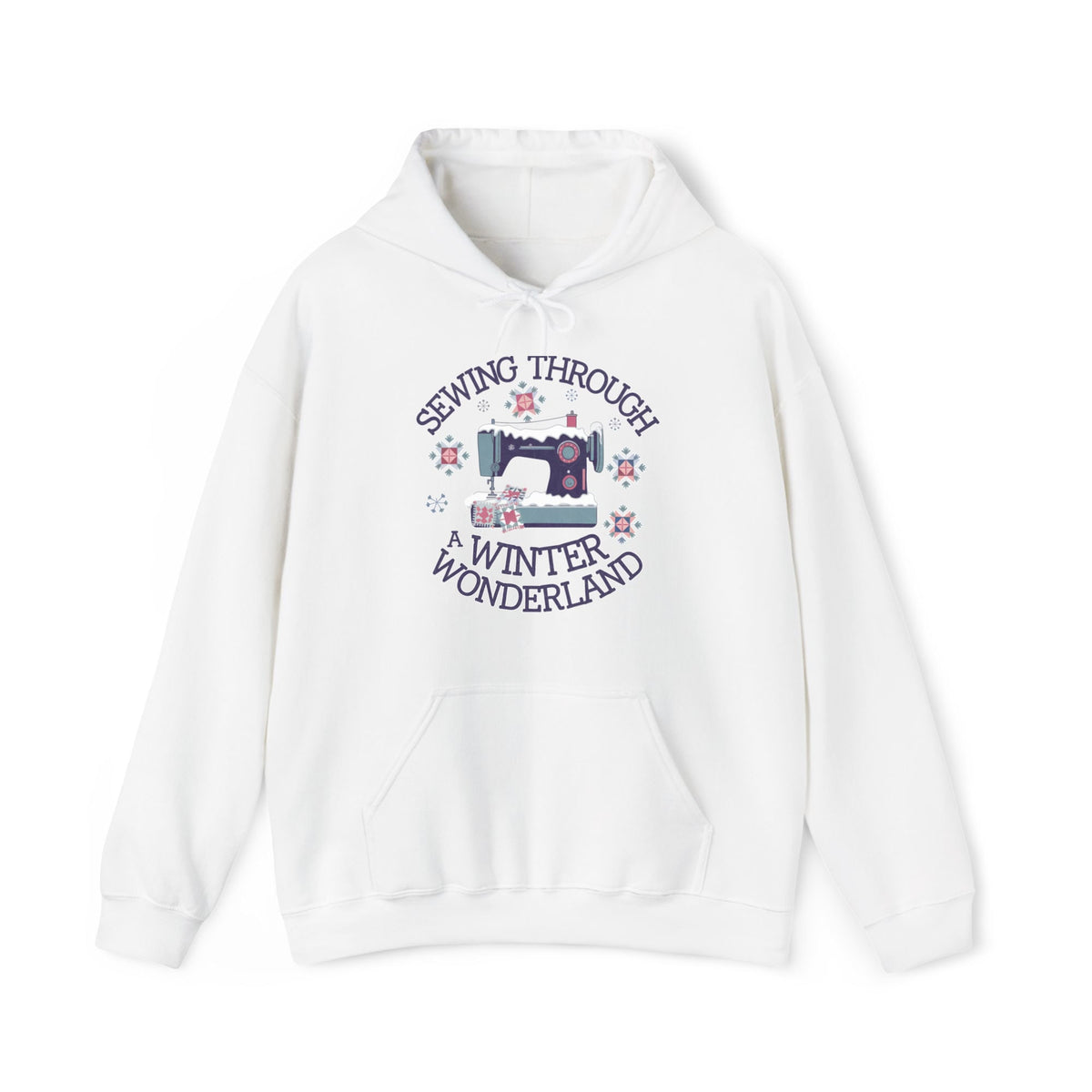 Quilter Gift: A White Hoodie with sewing machine covered in snow with festive quilting elements and "Sewing Through a Winter Wonderland" text