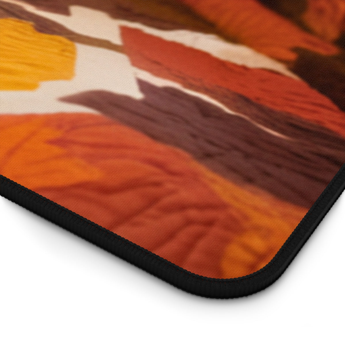A quilting inspired Desk pad design depicting a brown poodle resting on an autumn-themed quilt. The quilt features warm colors like orange, red, and brown, with intricate leaf patterns, creating a cozy and inspiring fall atmosphere for your workspace. Perfect gift for quilters.