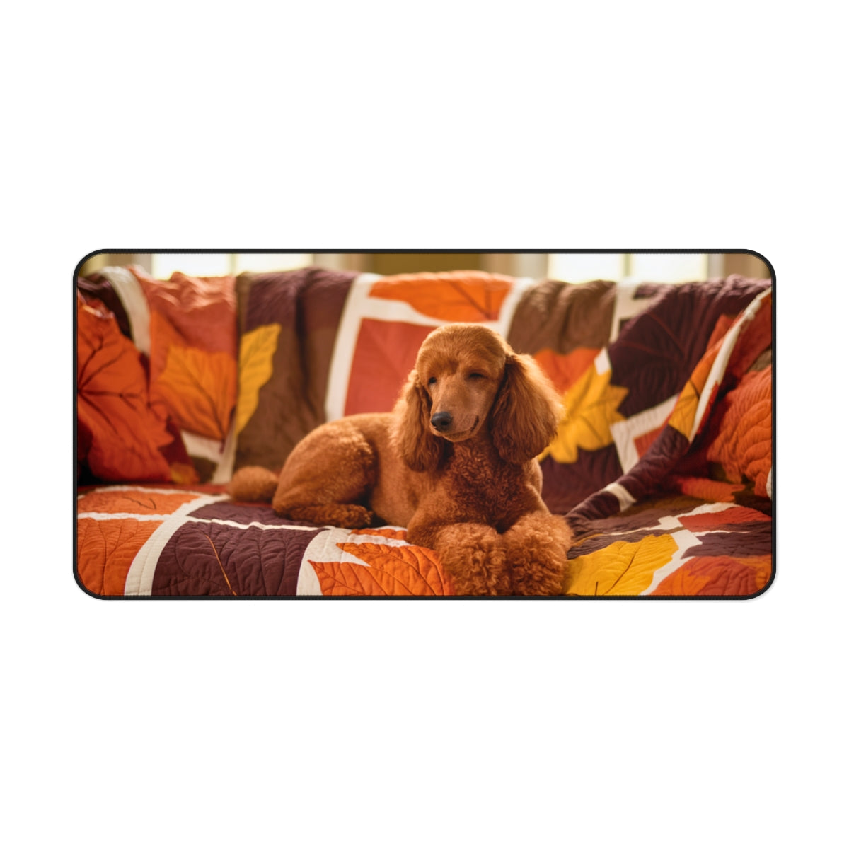 A quilting inspired Desk pad design depicting a brown poodle resting on an autumn-themed quilt. The quilt features warm colors like orange, red, and brown, with intricate leaf patterns, creating a cozy and inspiring fall atmosphere for your workspace. Perfect gift for quilters.