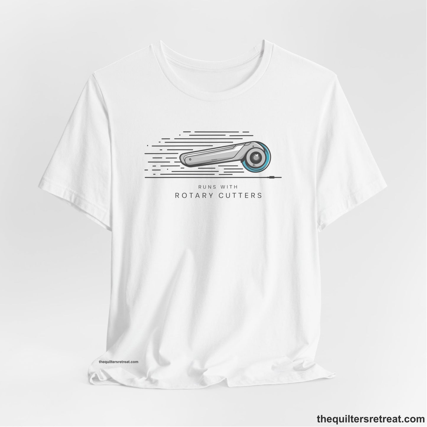 A White Short Sleeve T-Shirt with a rotary cutter illustration with dynamic lines and bold "Runs with Rotary Cutters" text