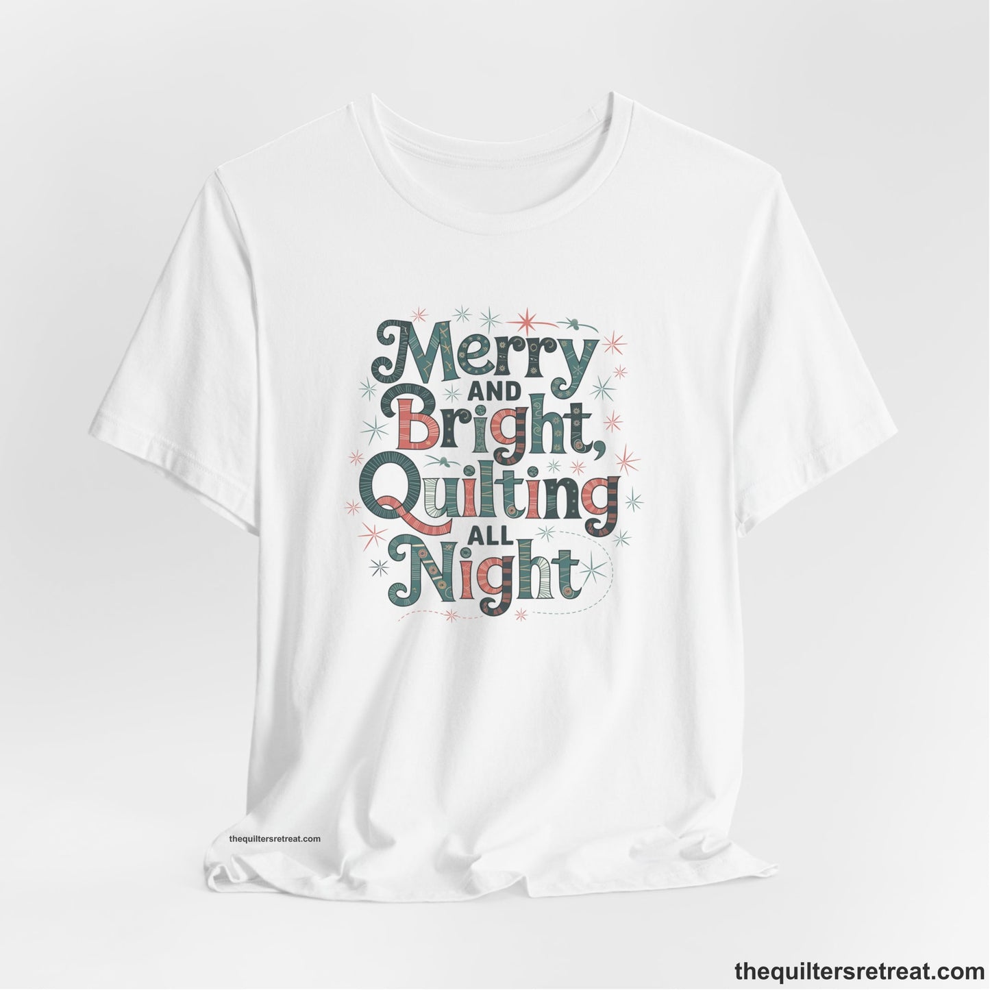 A White Short Sleeve T-Shirt with a Merry and Bright Quilting All Night text with festive patterns and stars in a whimsical style