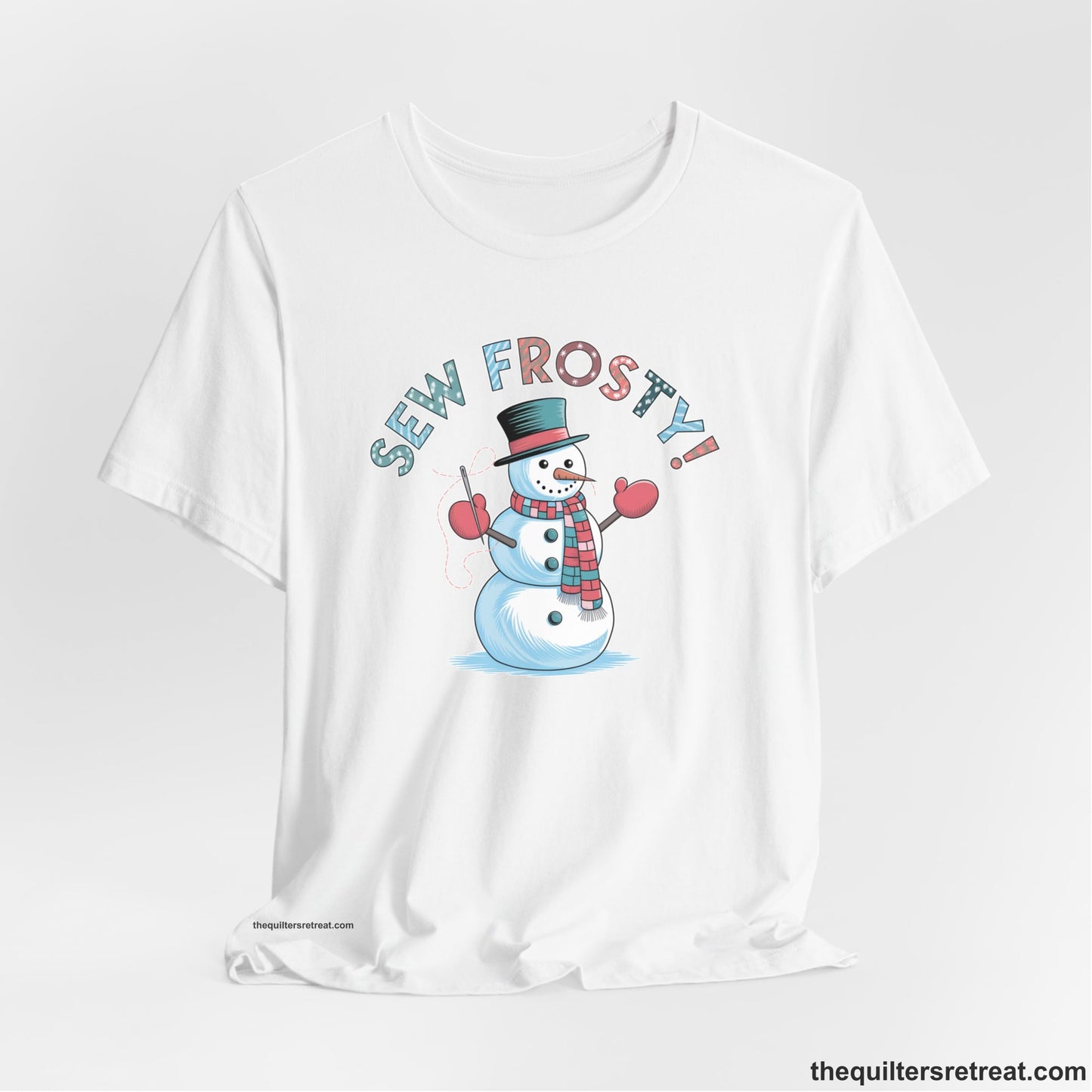 A White Short Sleeve T-Shirt with a playful snowman sewing illustration with "Sew Frosty!" text in a festive style