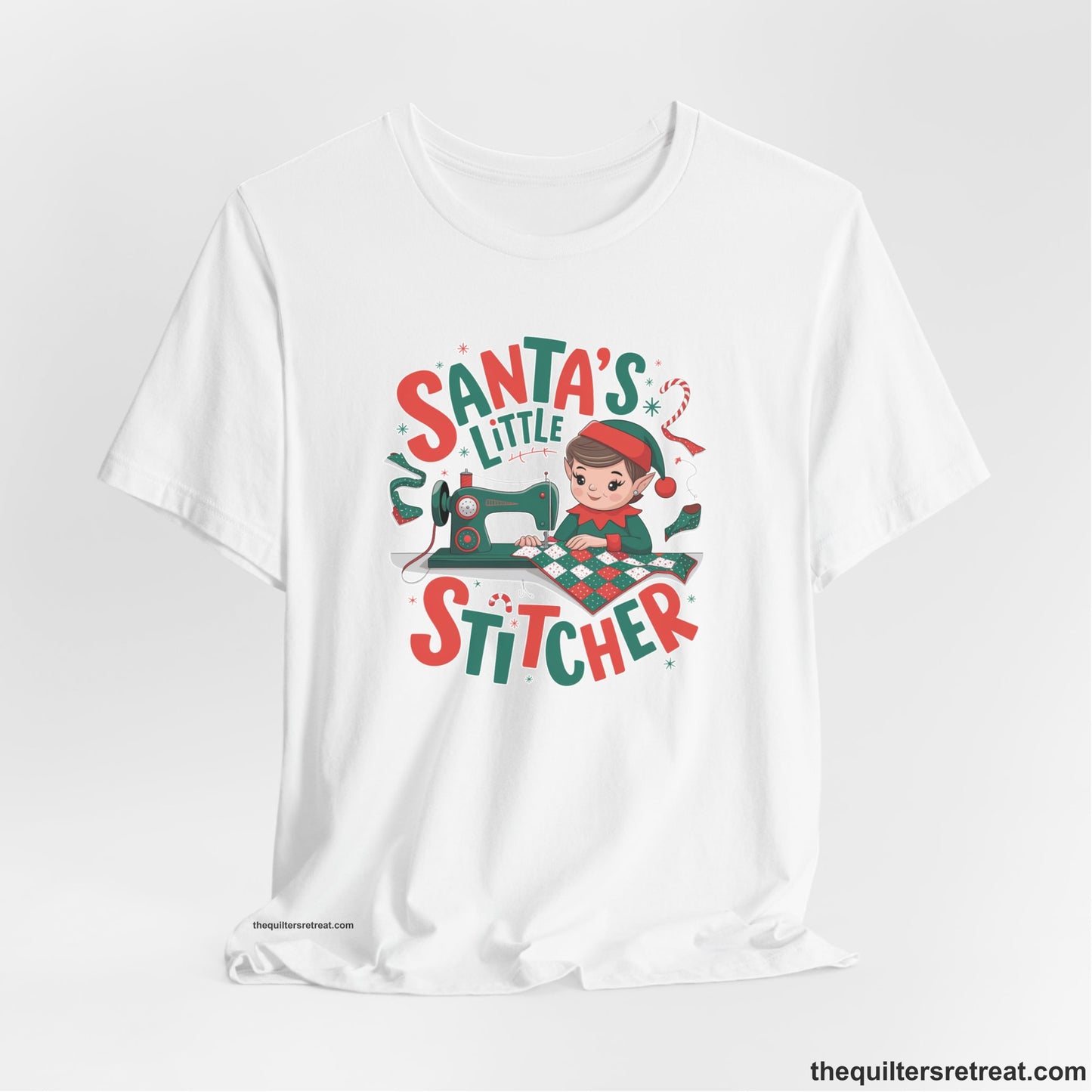 A White Short Sleeve T-Shirt with a santa's little stitcher elf sewing quilt with festive colors in playful style