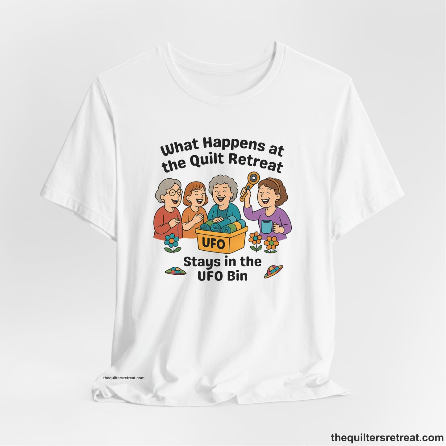A White Short Sleeve T-Shirt with a four smiling women with unfinished fabric objects and playful "UFO" text in a cartoon style