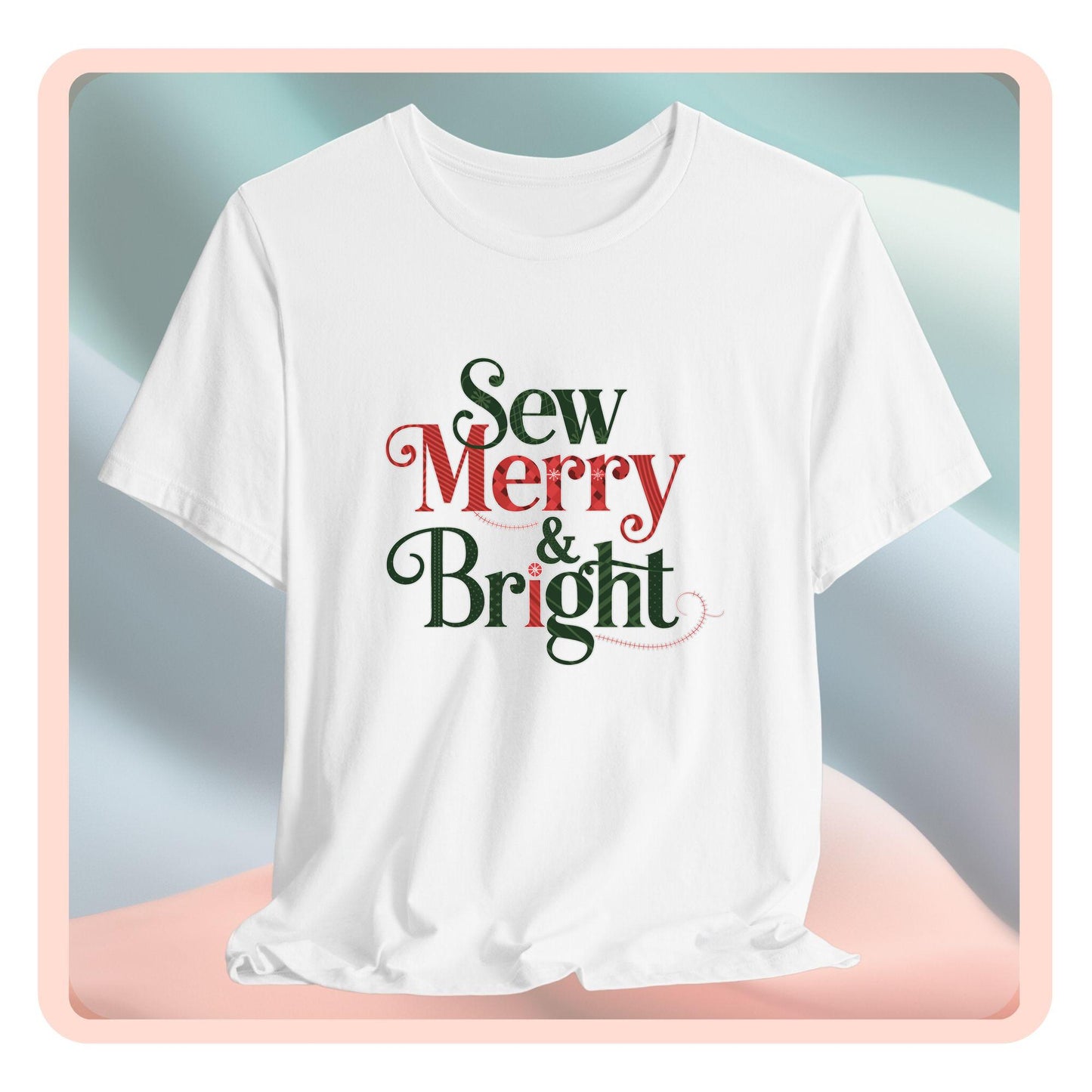 A t-shirt with the phrase "Sew Merry & Bright," incorporating sewing-inspired elements and holiday-themed accents, such as stitching lines and festive patterns.