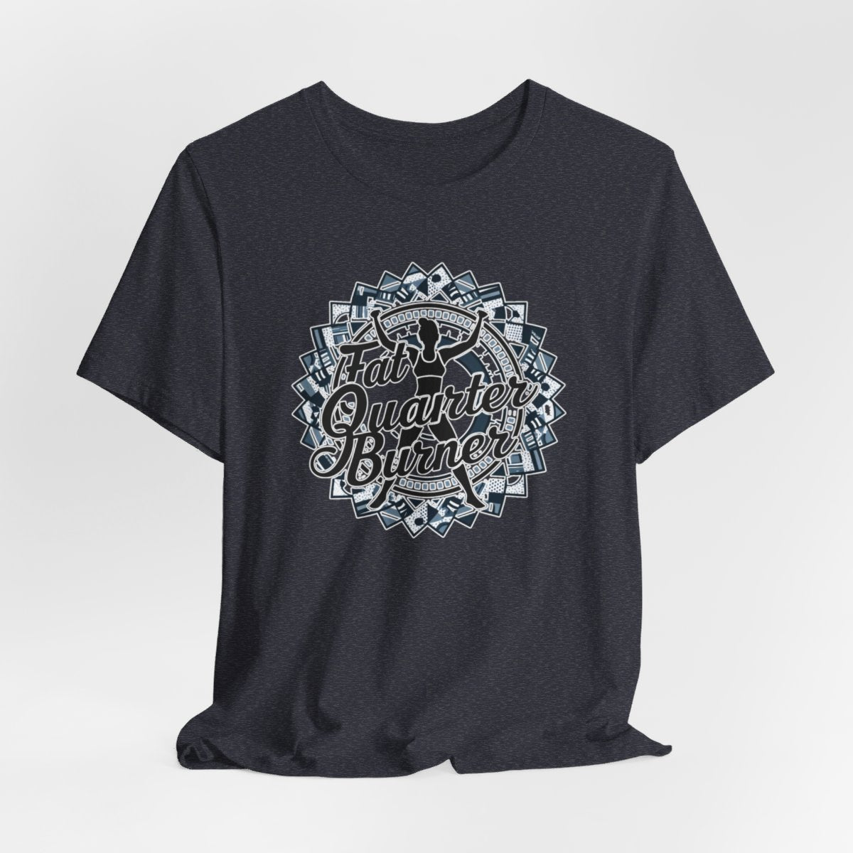 A Heather Navy T-Shirt featuring a patchwork border surrounding silhouette of woman lifting weights. Text reads "Fat Quarter Burner" in bold script.