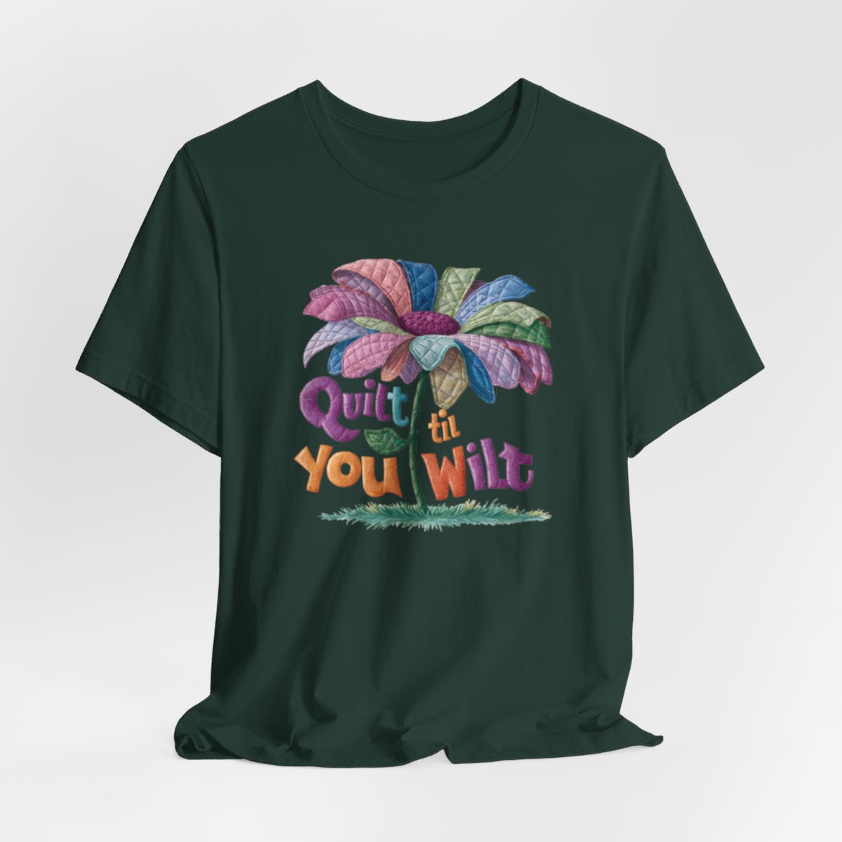 A Forest funny quilting T-Shirt with the phrase Quilt 'Till You Wilt showing a cheerful, but slightly wilted quilted flower design