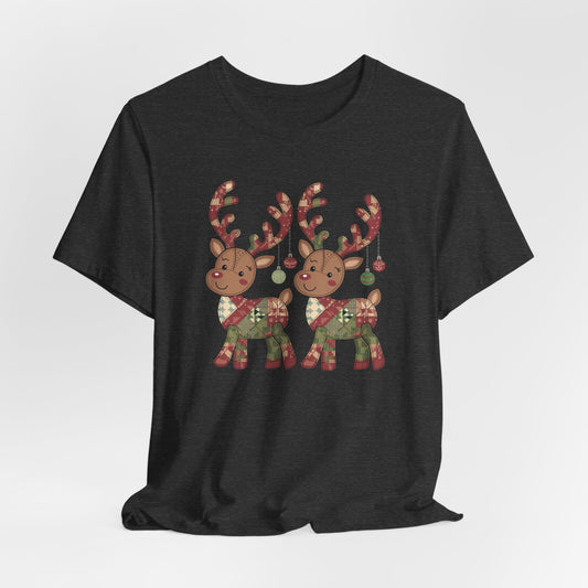 A Dark Grey Heather christmas quilting t-shirt featuring two adorable reindeer featuring patchwork quilt designs on their bodies, with ornaments hanging from their antlers, blending Christmas cheer with quilting creativity.